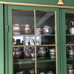 Neoclassical Green Painted and Parcel-Gilt Breakfront Bookcase