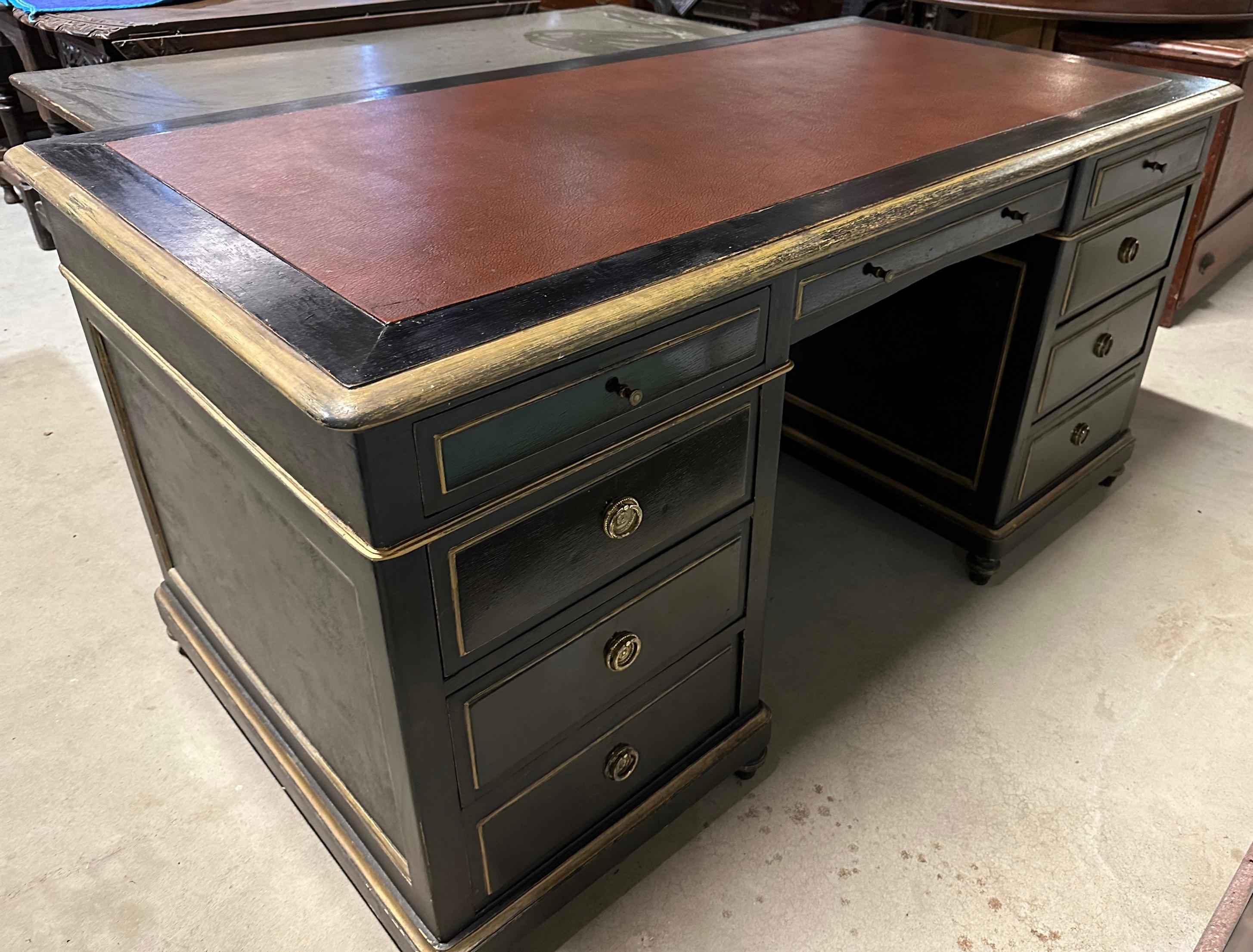 A superb double pedestal three-part desk with 6 large drawers, 2 smaller drawers and 1 small elongated center top drawer. The leather-lined desktop provides the perfect writing surface, as well as an additional hint of luxury. Meant to stand at the