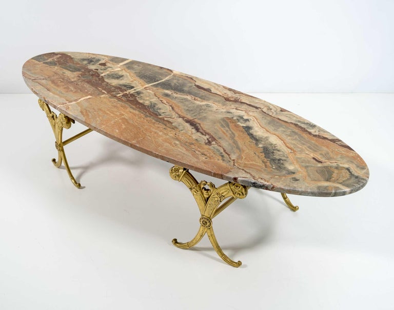 Neoclassical style coffee table, with solid brass base and marble top. Italian production from the 1950s.