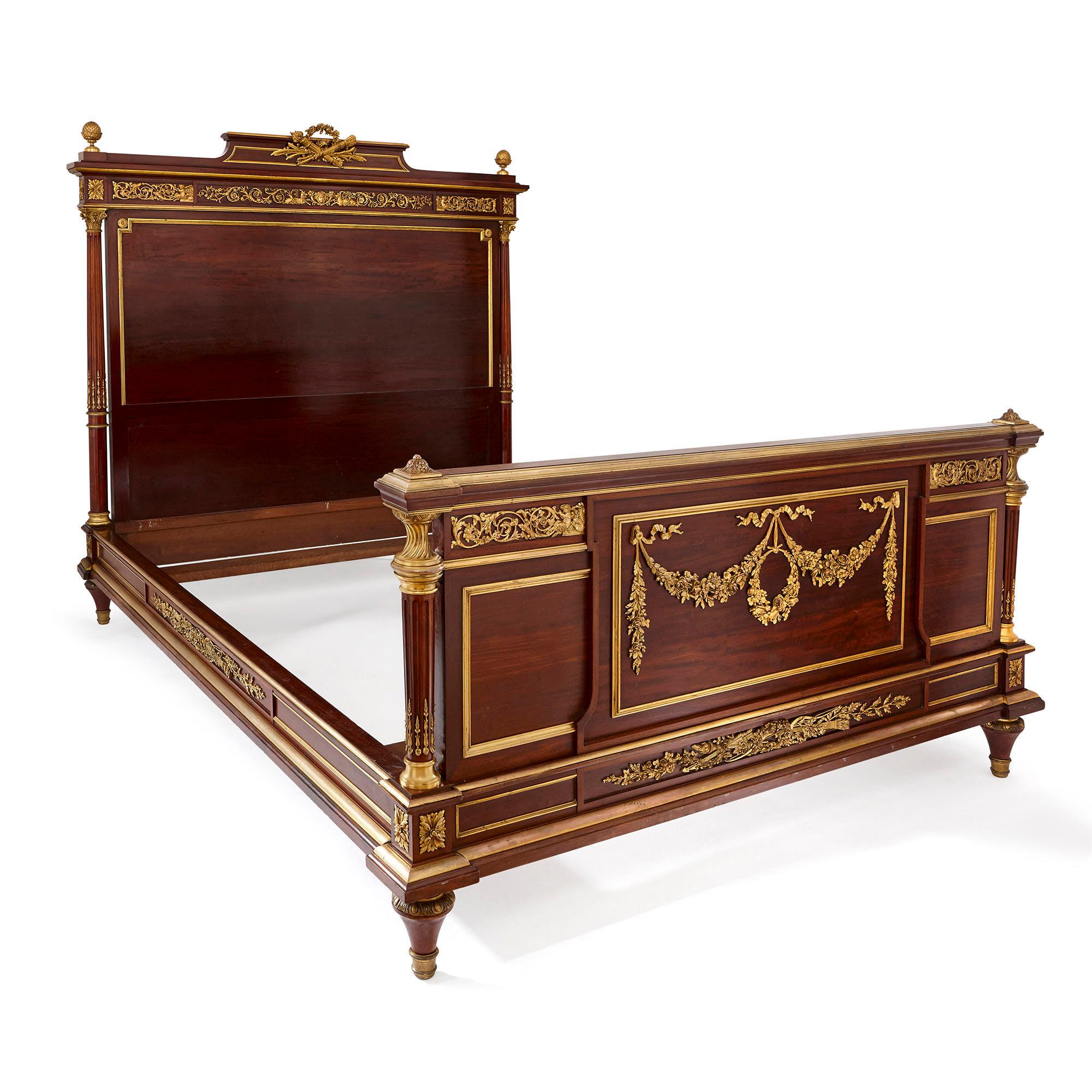 This beautiful bed is crafted from rich, warm-colored mahogany wood and elegantly decorated with gilt bronze (ormolu) mounts. In its style, this bed is inspired by furniture design of the French Louis XVI period (1774-1793). 

The bed is composed