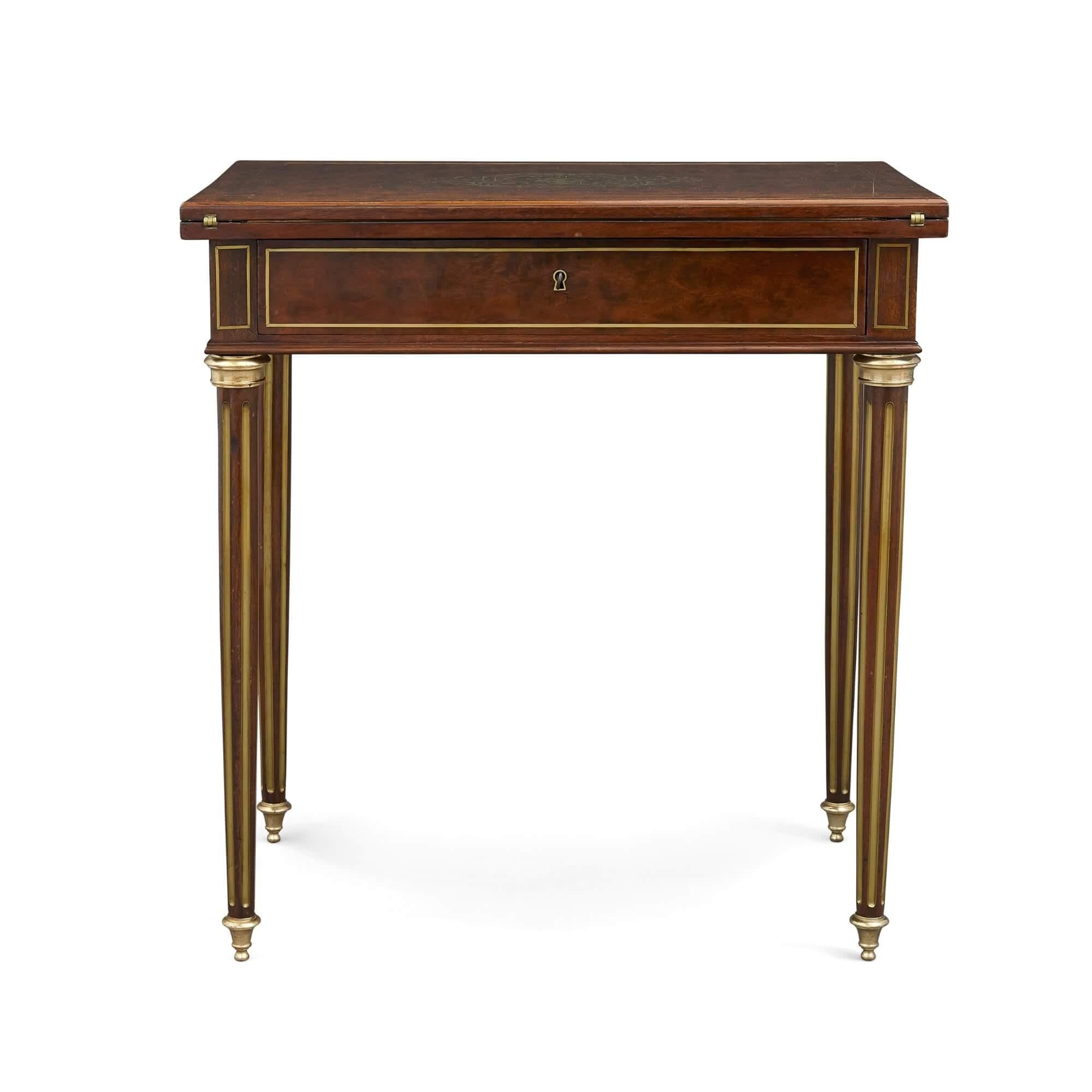 Neoclassical style mahogany card, dressing, and writing table
French, 19th century
Measures: Height 75cm, width 70cm, depth 45cm

This charming table is an ingenious piece of design. The table serves three functions: it works as a writing desk,