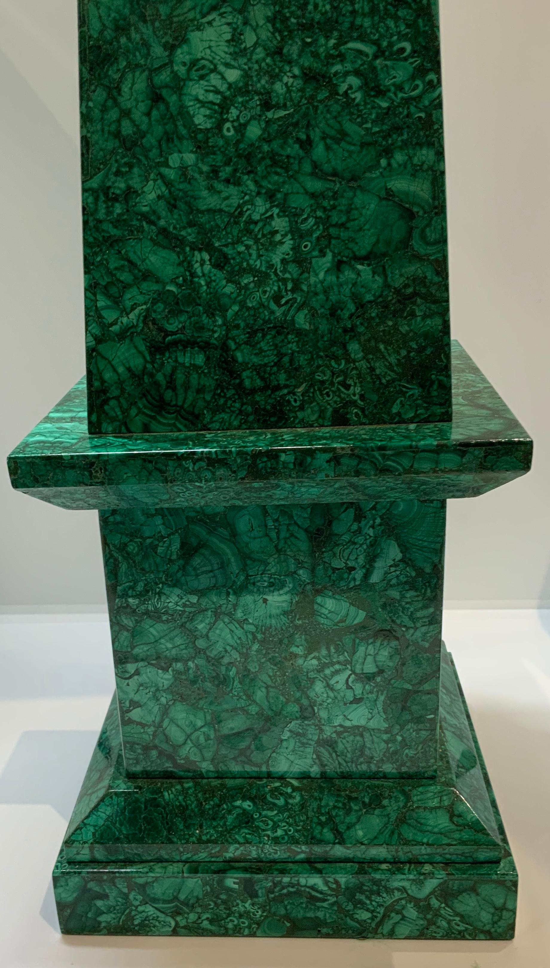 Imposing and solid malachite stone tower shaped as a square base with a long tapered rectangular body and ending with a pyramidal too.