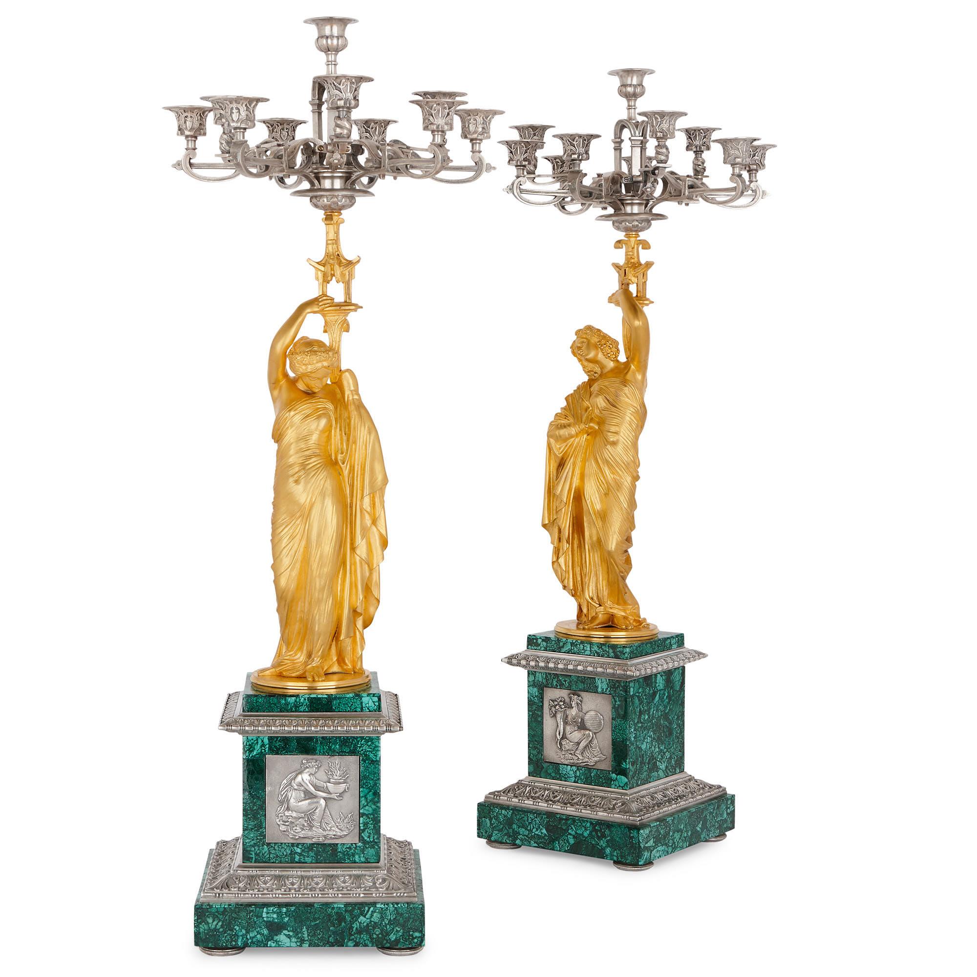 This spectacular clock set is based on the works of the esteemed Neoclassical artist James Pradier (French, 1790-1852), whose sculptures can be found in nearly all of Paris's major museums and landmarks. Pradier designed all the bronze figures and