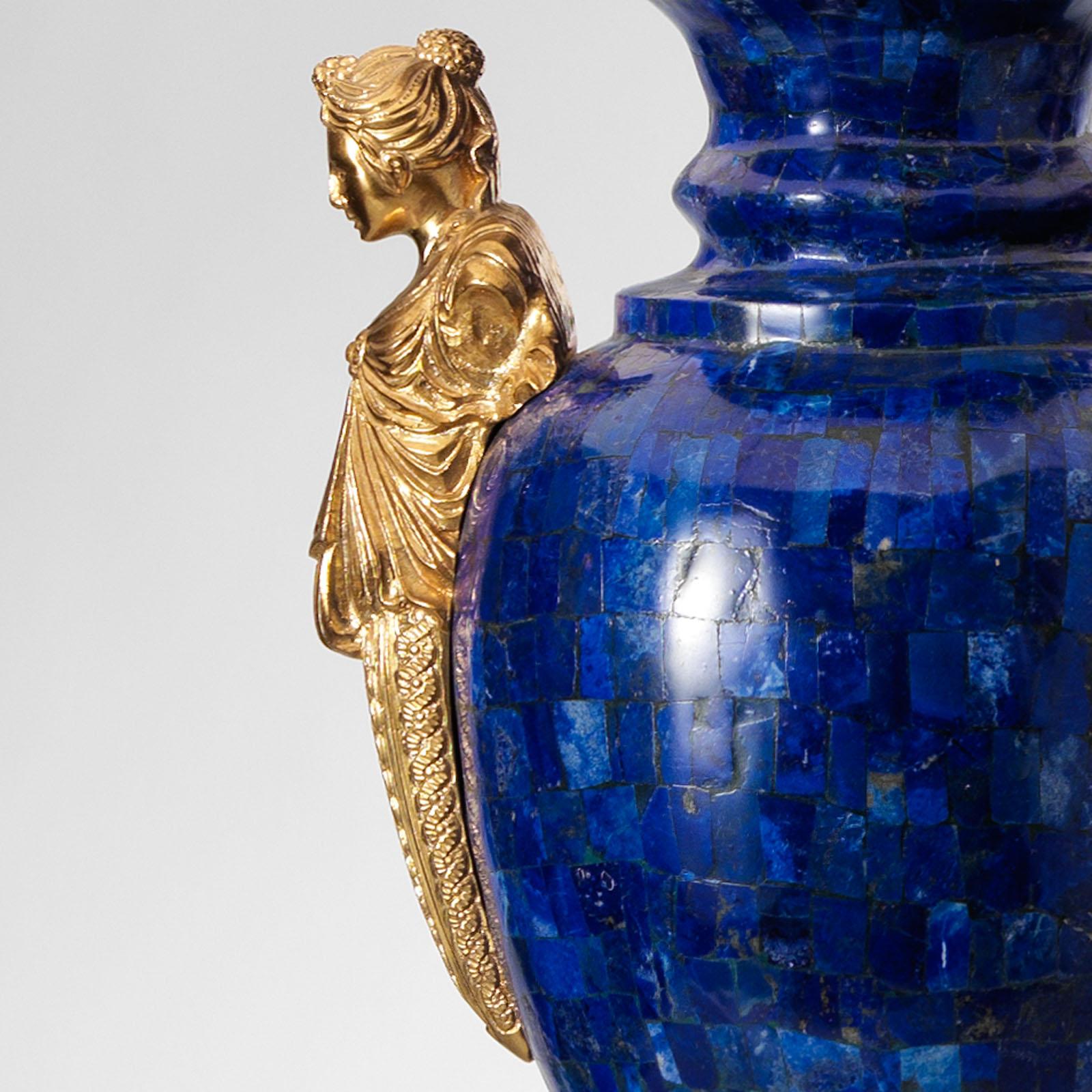 This neoclassical style marble and gilt bronze vase by Gherardo Degli Albizzi are exceptional pieces of luxury design. Vases, which have an ovoid form, feature bulbous marble bodies are flanked by twin gilt handles or caryatids. The foot is