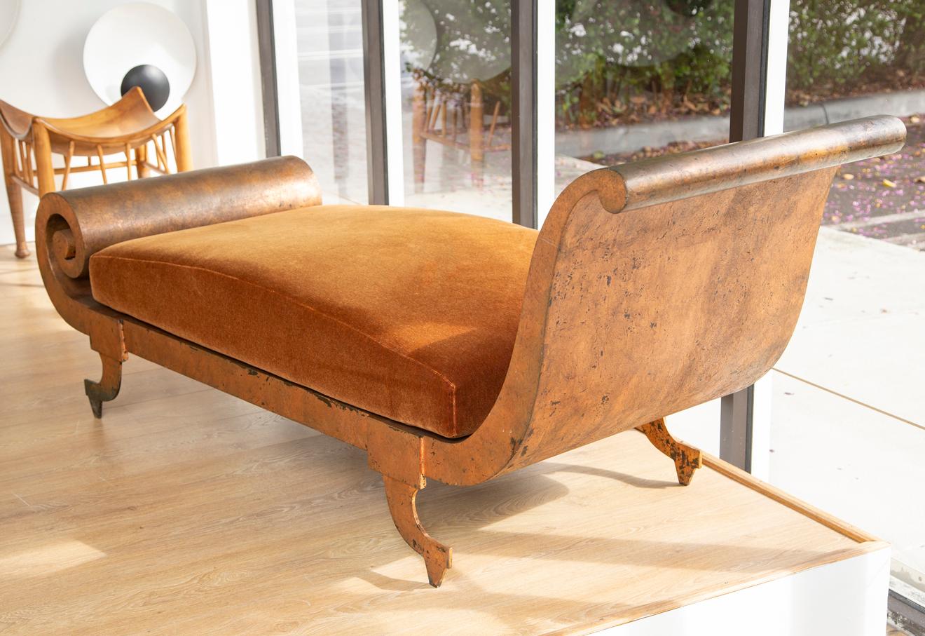 Neoclassical style metal daybed with copper patina by Lyle and Umbach
USA circa 1980
Features one curved end and another end terminating in a scroll
We love the distressed copper/metal patina
Original uphostery in copper mohair (from previous