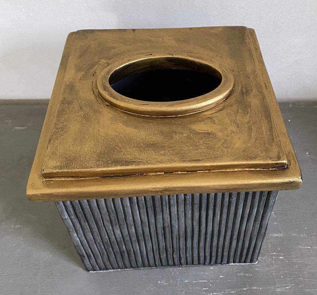 Add style and the finishing touch to your countertop or nightstand with this antiqued gold toned top and grey ribbed metal body tissue box cover to protect your facial tissues. Be it Swedish Gustavian, Louis XVI style, Hollywood Regency or