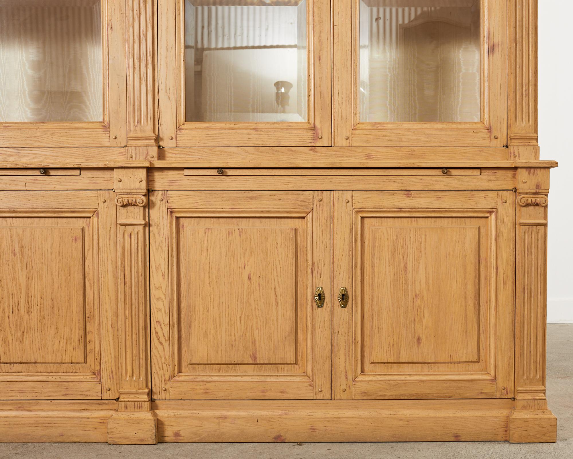 Brass Neoclassical Style Oak Library Bookcase with Beveled Glass Doors For Sale