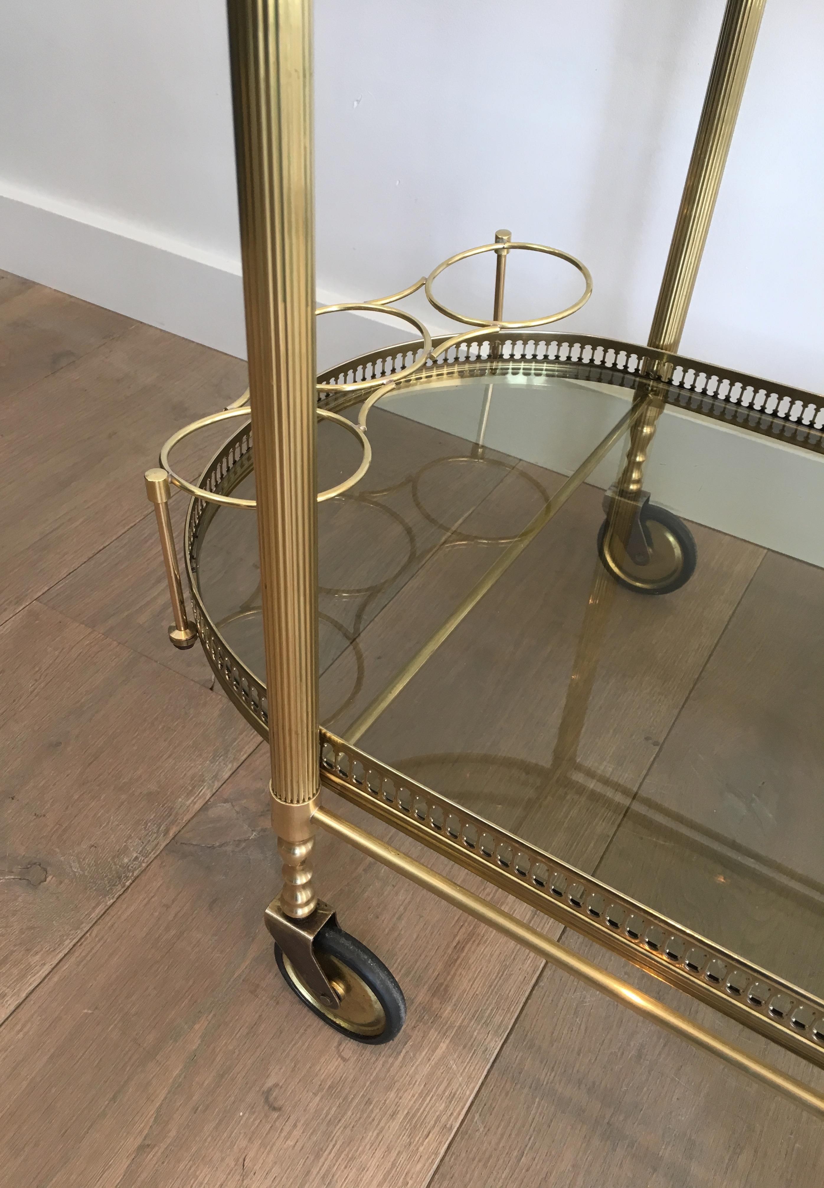 Neoclassical Style Oval Brass and Gilt Bar Cart with Greenish Smoked Glass 7