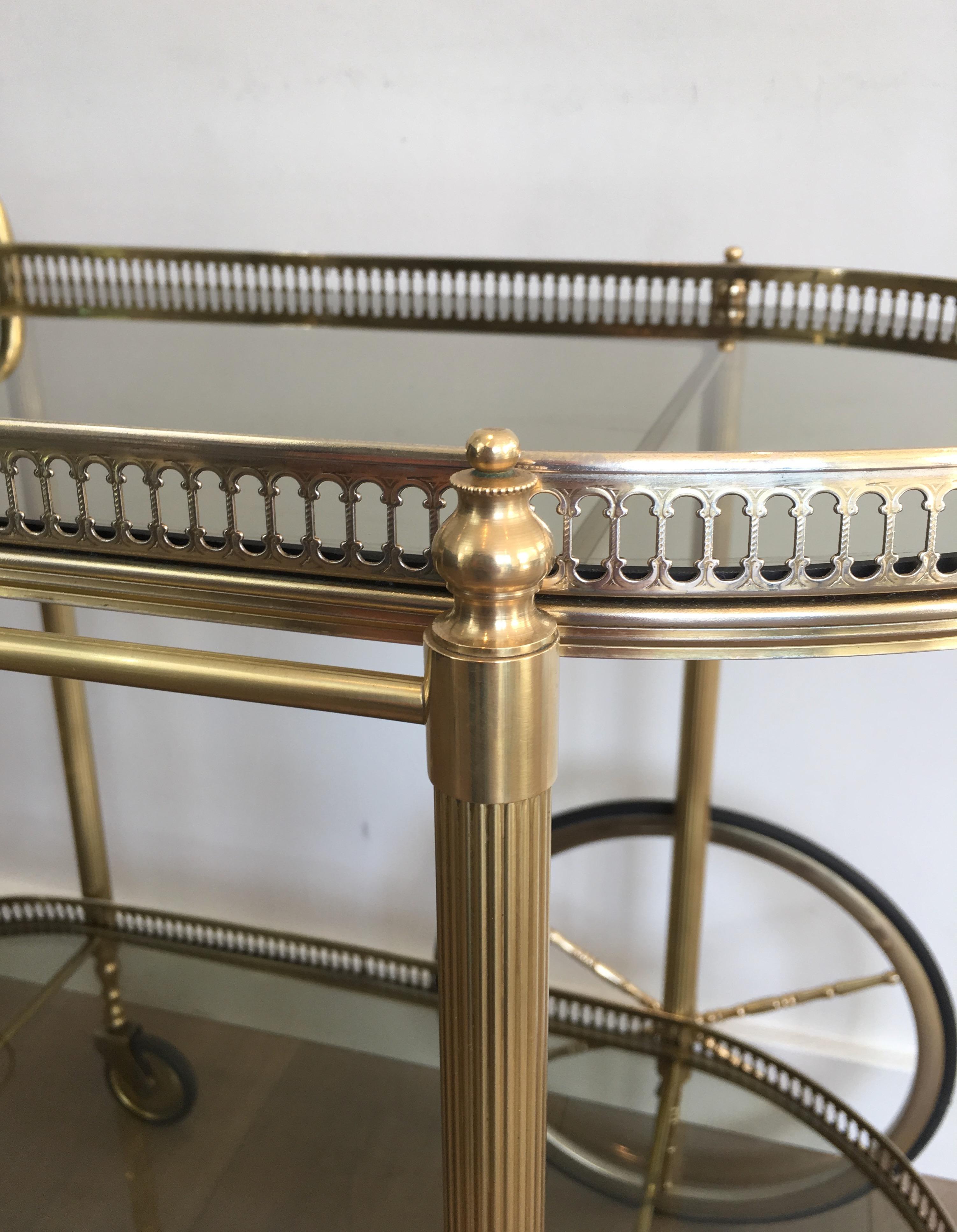 Neoclassical Style Oval Brass and Gilt Bar Cart with Greenish Smoked Glass 8