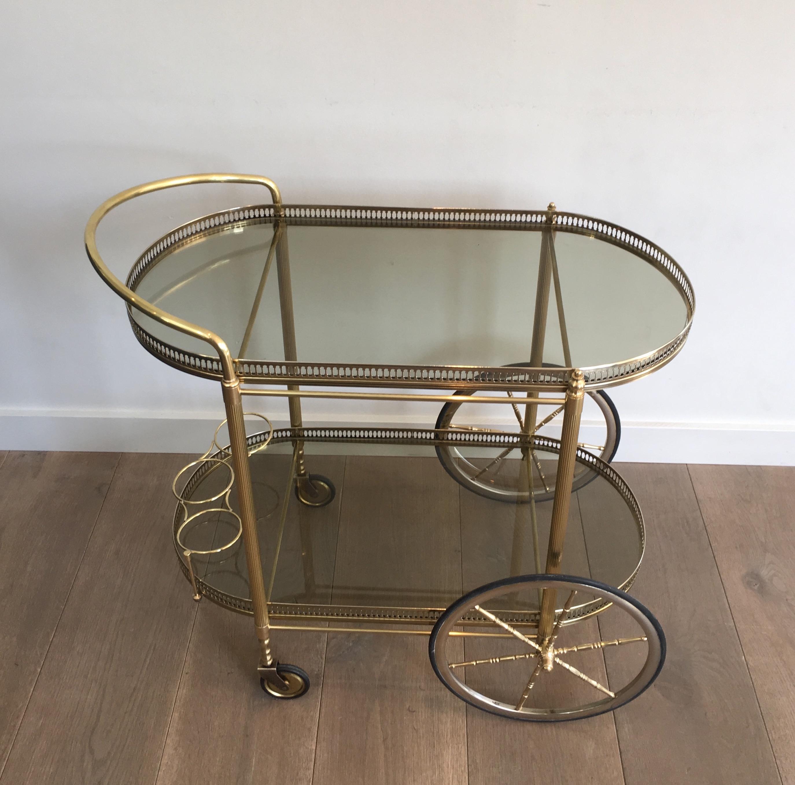 Neoclassical Style Oval Brass and Gilt Bar Cart with Greenish Smoked Glass 12