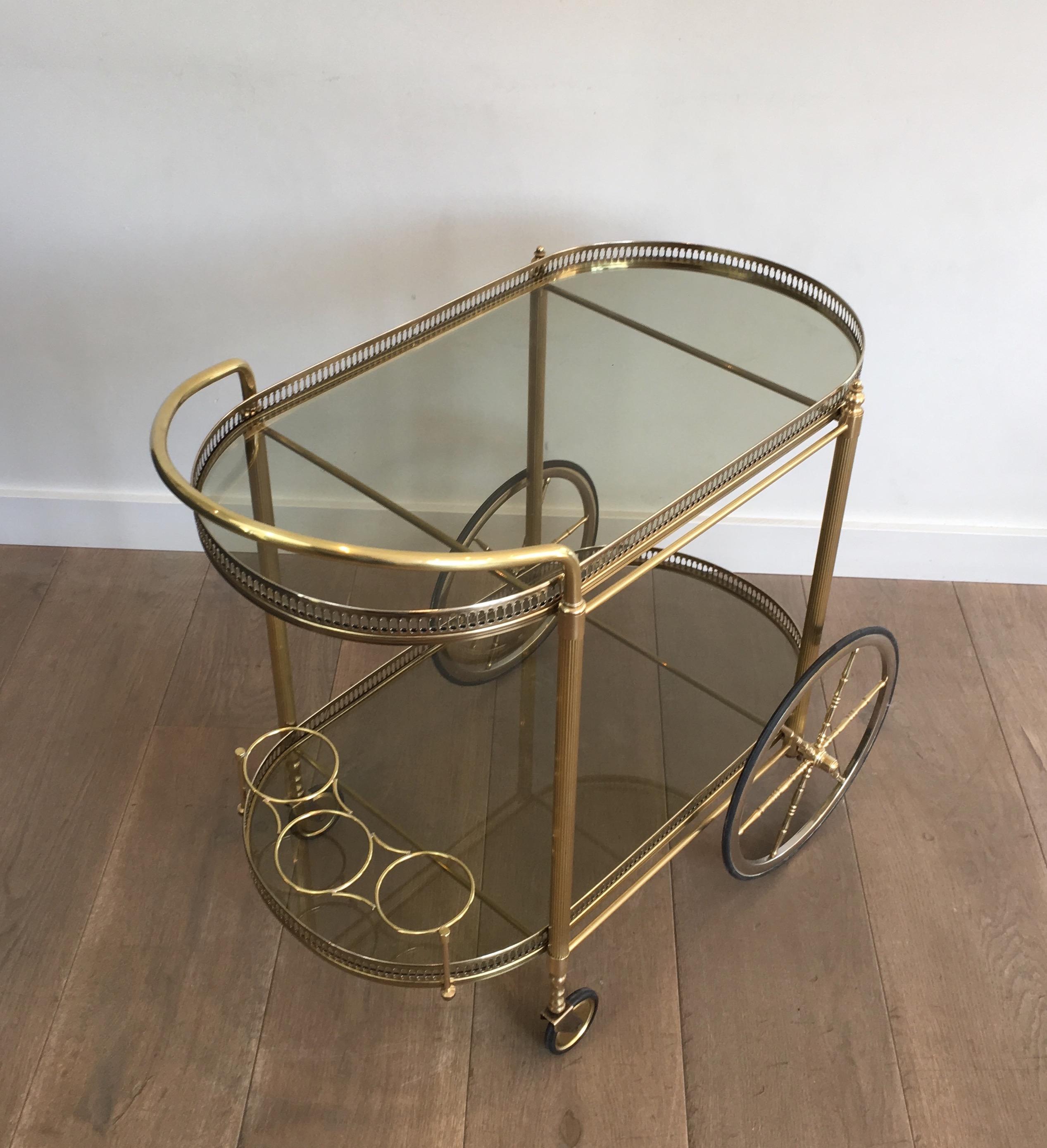 Neoclassical Style Oval Brass and Gilt Bar Cart with Greenish Smoked Glass 13