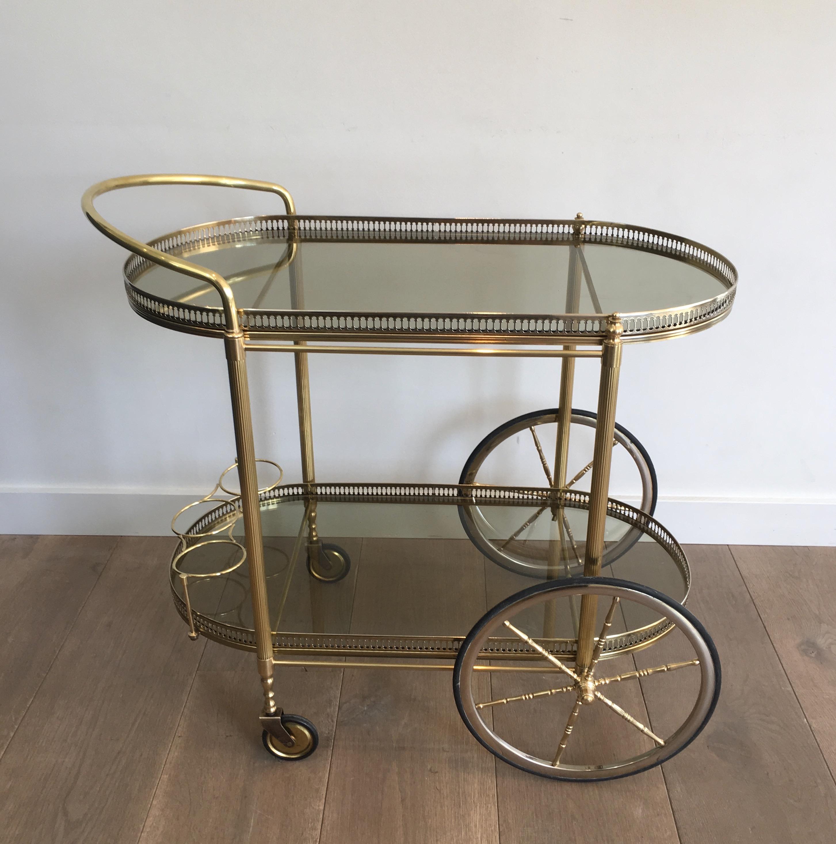 Neoclassical Style Oval Brass and Gilt Bar Cart with Greenish Smoked Glass 14
