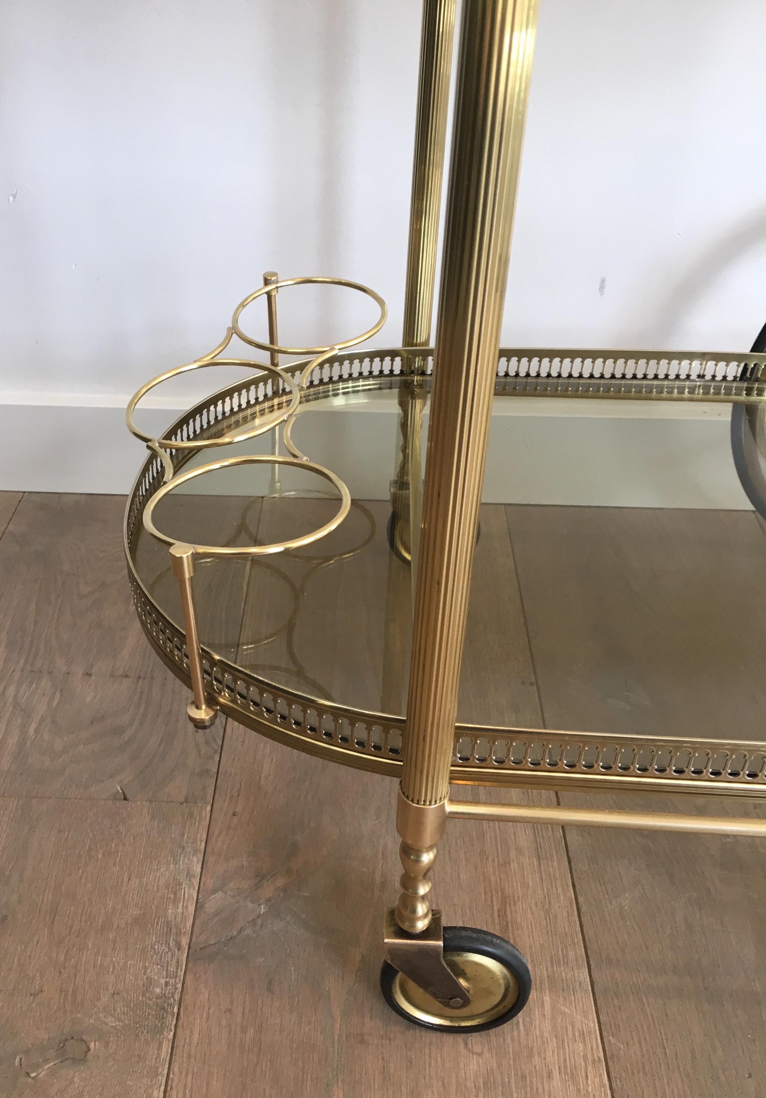 Late 20th Century Neoclassical Style Oval Brass and Gilt Bar Cart with Greenish Smoked Glass