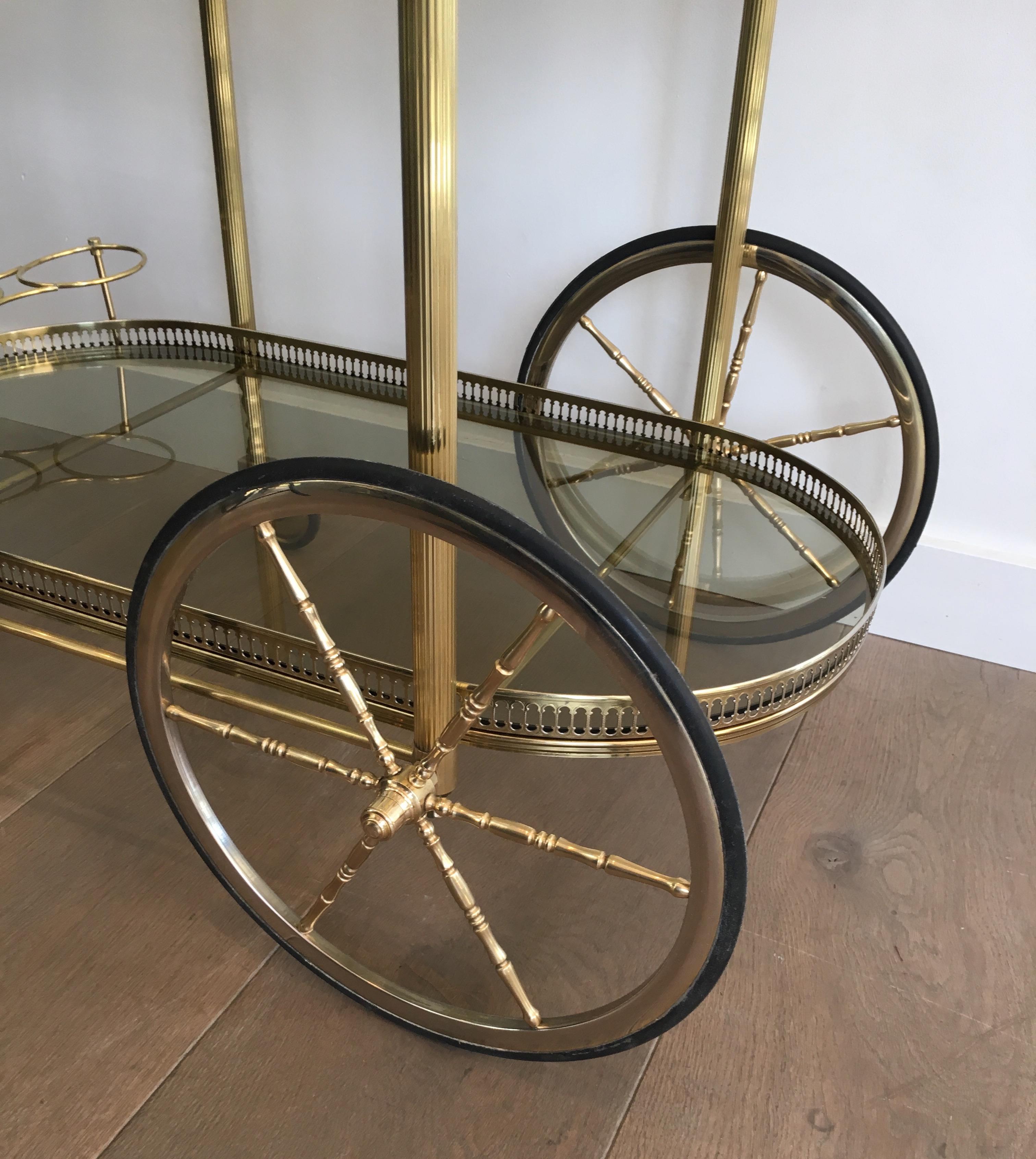 Neoclassical Style Oval Brass and Gilt Bar Cart with Greenish Smoked Glass 2