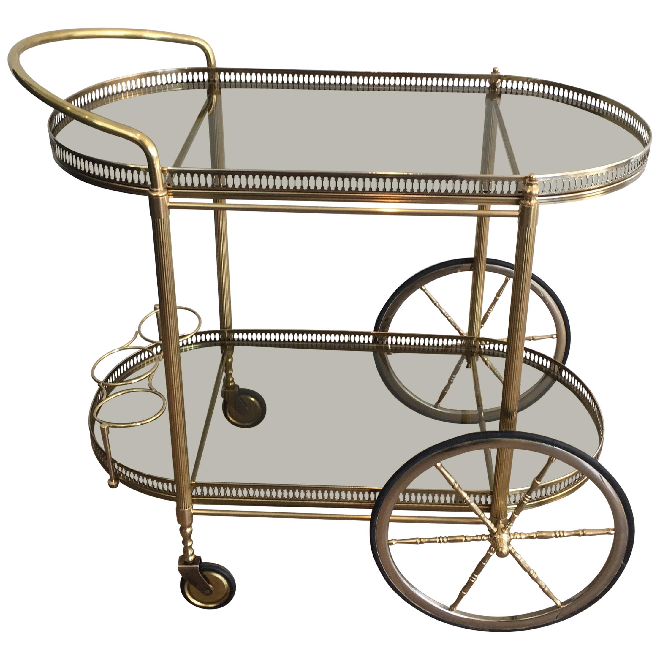 Neoclassical Style Oval Brass and Gilt Bar Cart with Greenish Smoked Glass