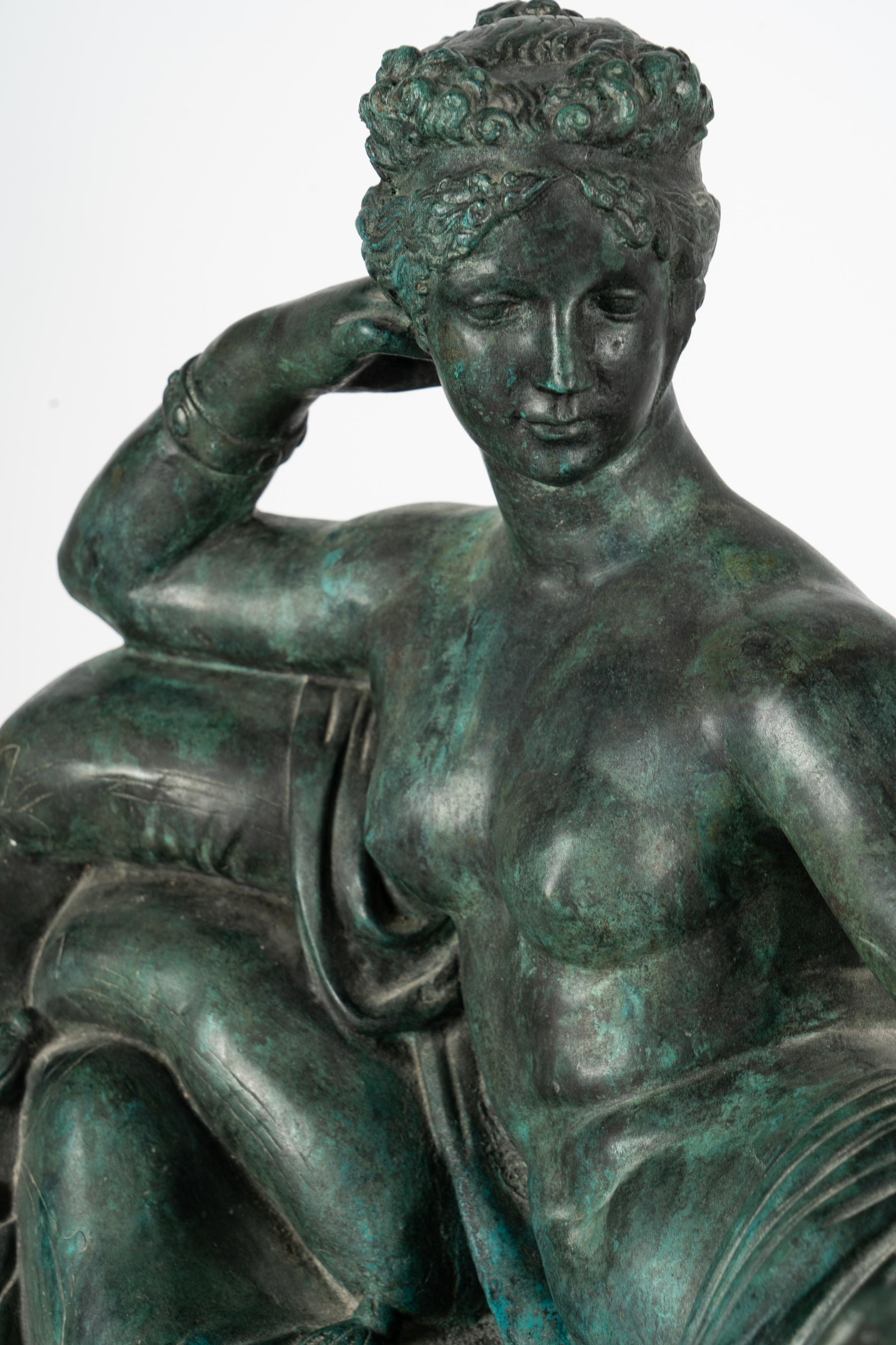Neoclassical-Style Patinated Bronze Figure of a woman laying sideways. Bottom portion of body is covered as top of body is exposed. Measures approx -20h x 37w x 11d
