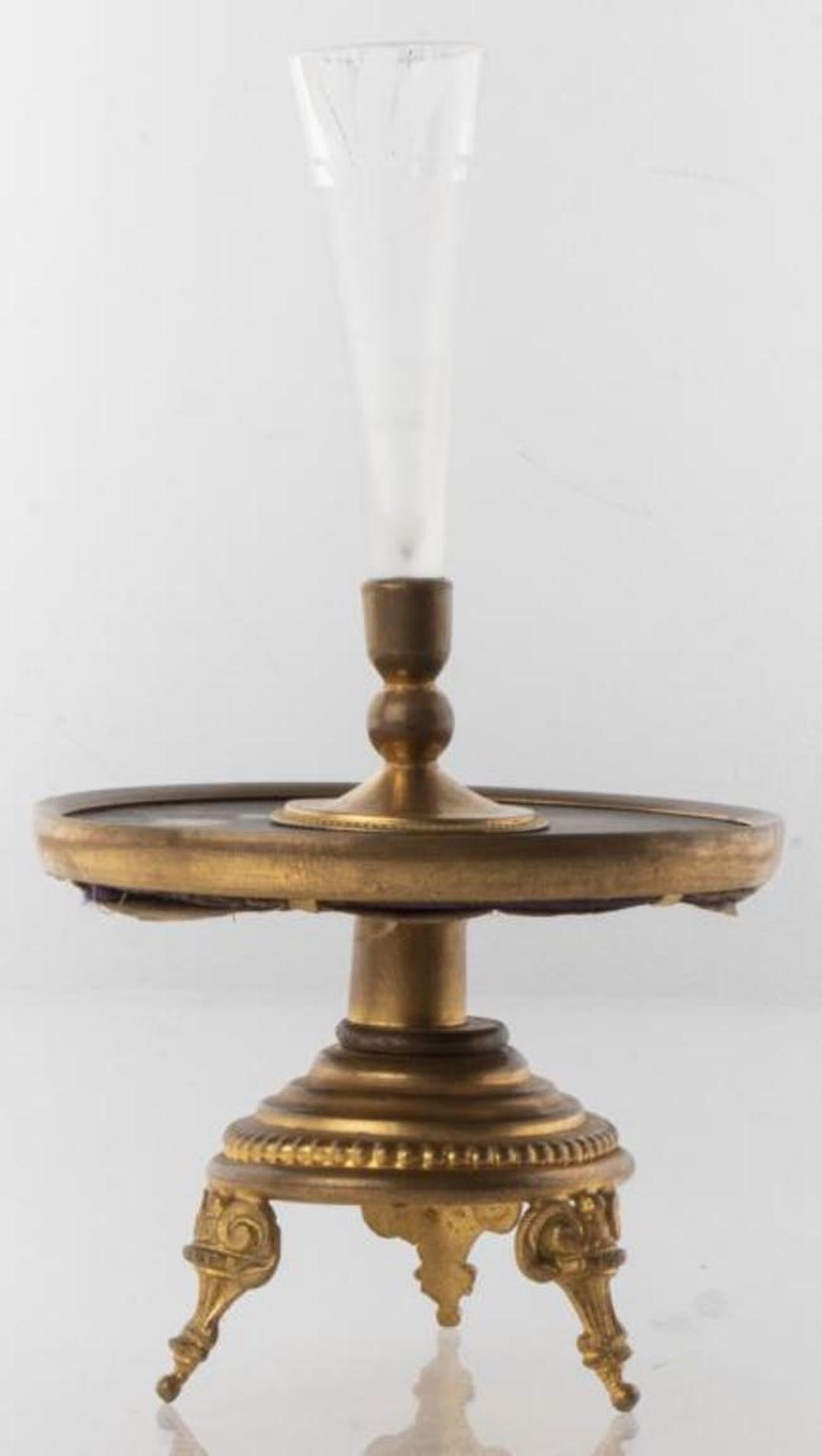 Neoclassical style candlestick with tapered frosted glass holder, floral motif pietra dura inlaid drip dish, and tripod brass base. 7.5