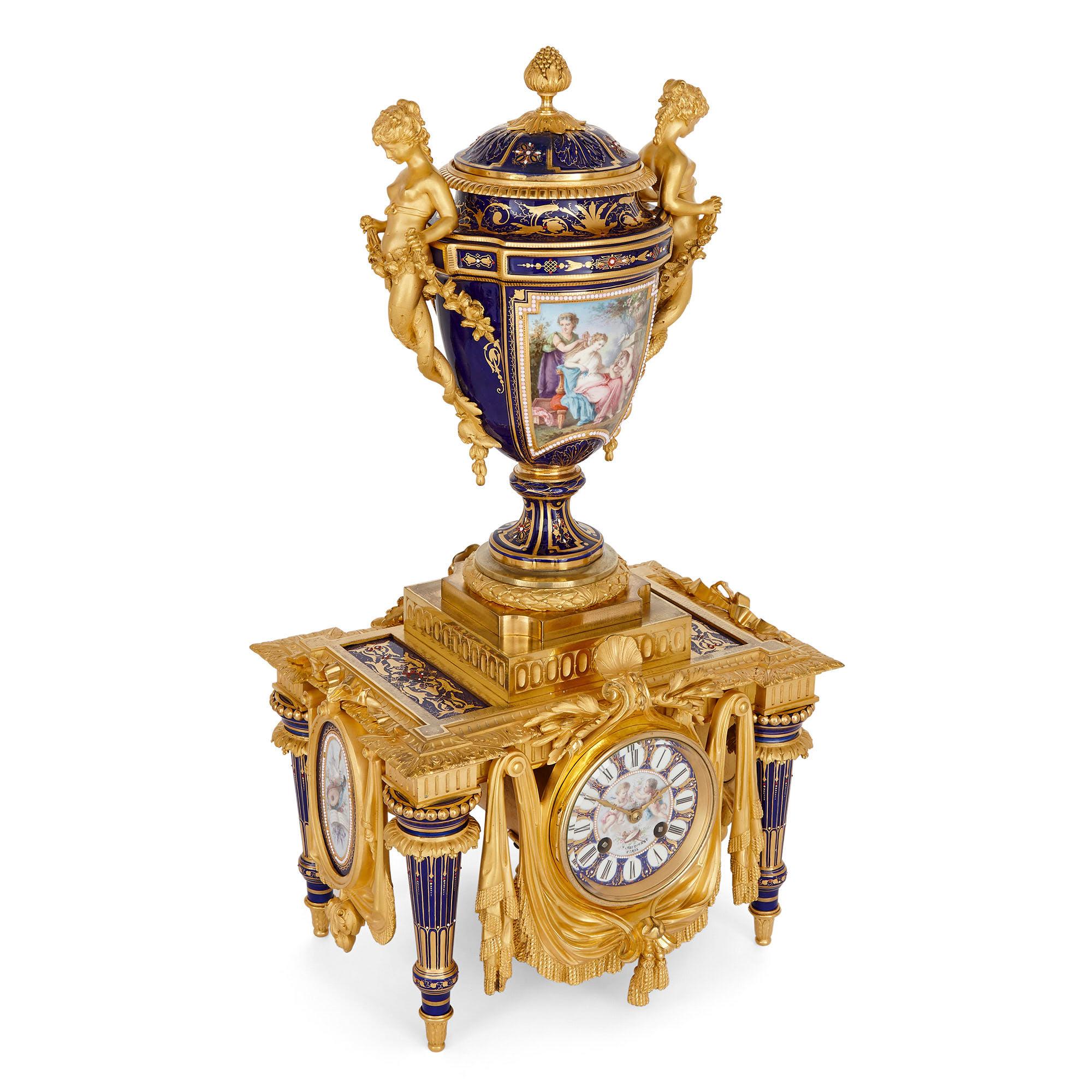 Neoclassical style porcelain and gilt bronze clock set by Barbedienne
French, late 19th Century
Clock: Height 53cm, width 27cm, depth 24cm
Candelabra: Height 56cm, width 19cm, depth 16cm

This superb clock set was designed in the late 19th
