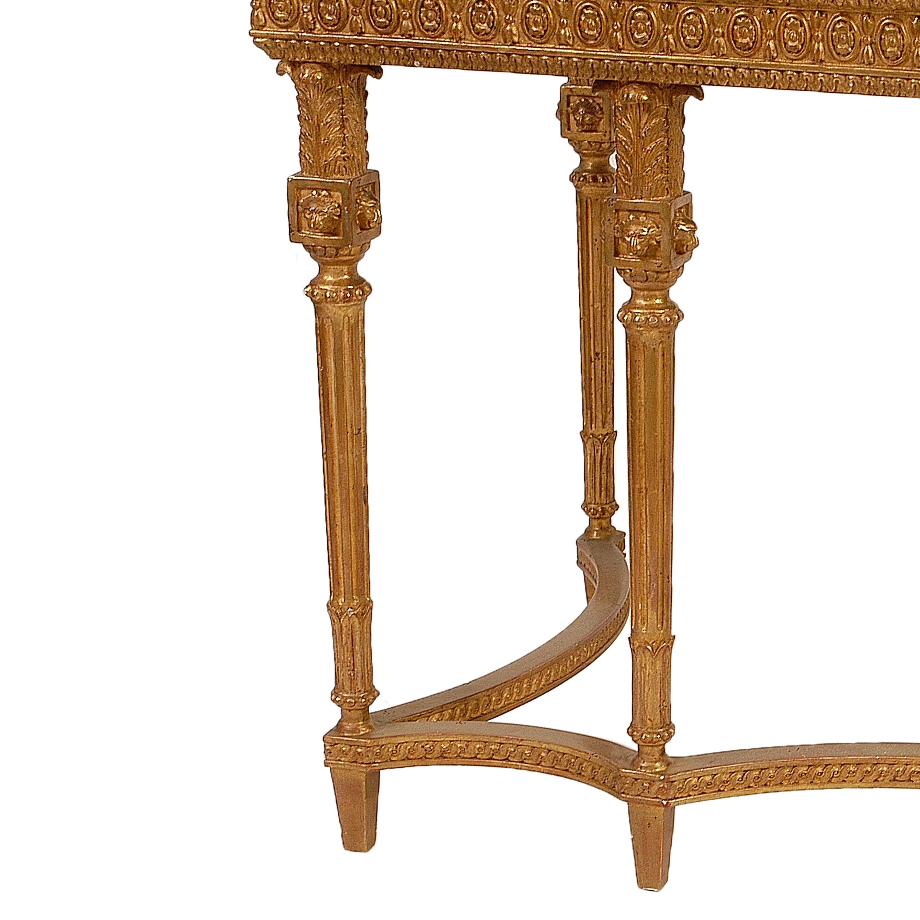 Neoclassical style console hand carved wooden structure with gold leaf finished and top in Calacatta Viola marble. Spain, 1970.