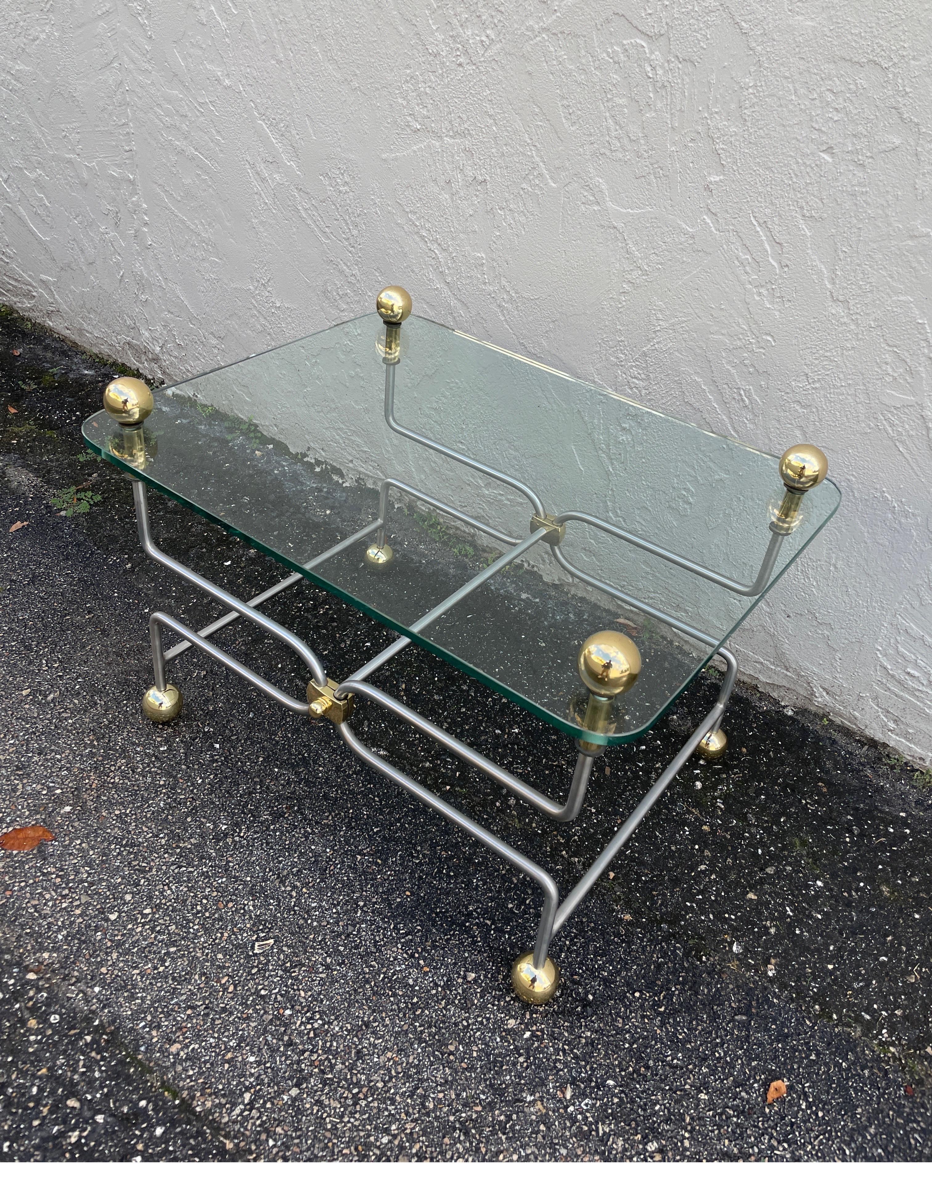 Neoclassical style steel & brass coffee / cocktail table with brass ball details.