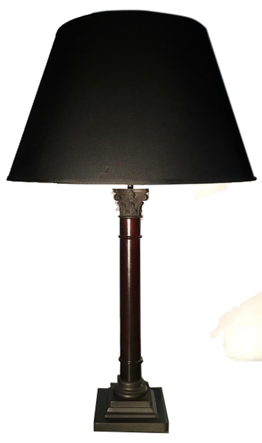 This elegant table lamp is an Italian  contemporary production.
The column in wood has a wenghe finish, the lampshade is in black fabric.
On the top and on the foot there are bronze cast details.

EU wiring
USA GB wiring on request and price