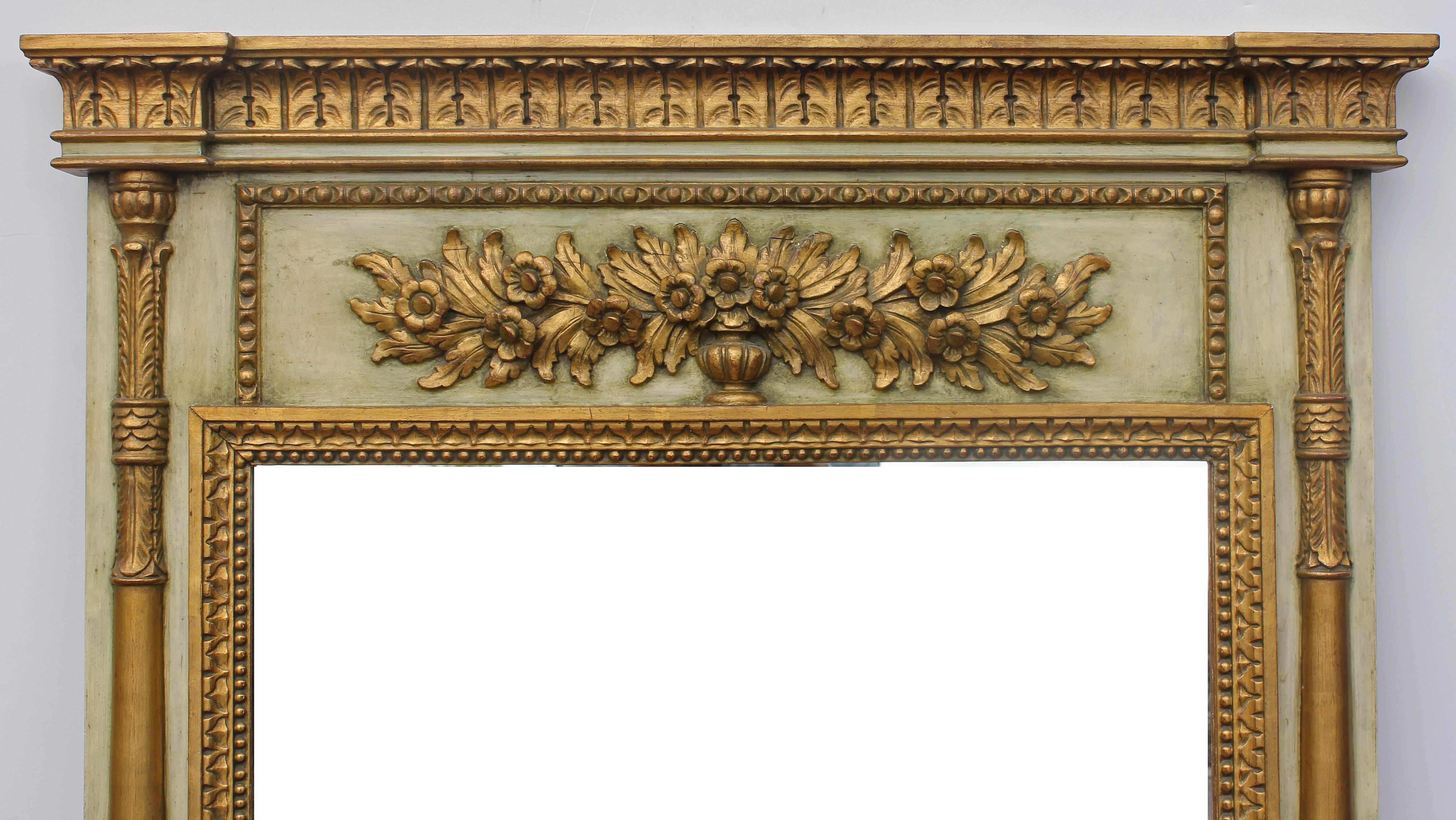 Neoclassical style carved and gilt trumeau mirror. Handmade by Italian manufacturer Pinol DeLuca, early 20th century.