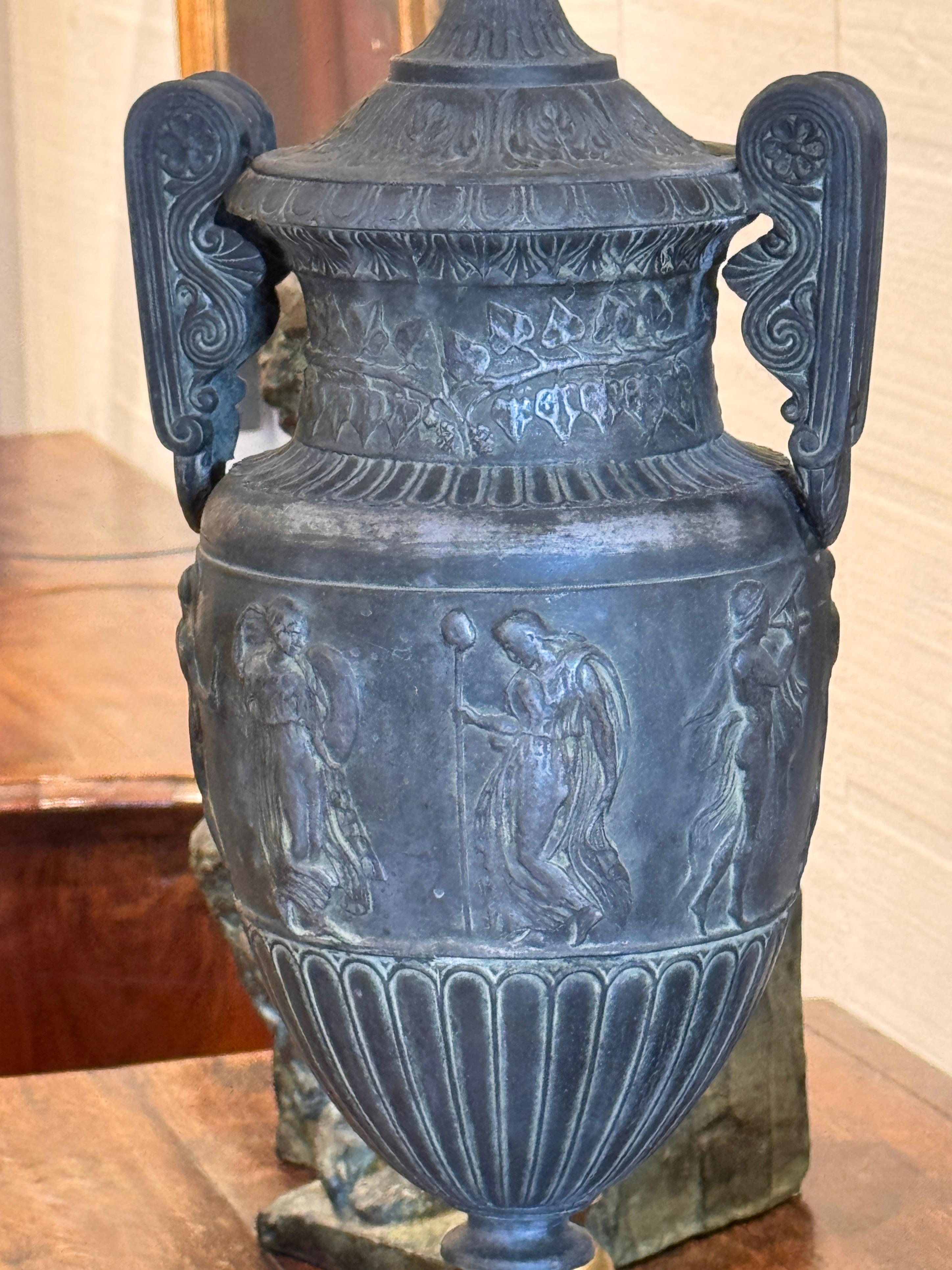 Metal Neoclassical Style Urn Form Lamp With Figural Relief For Sale