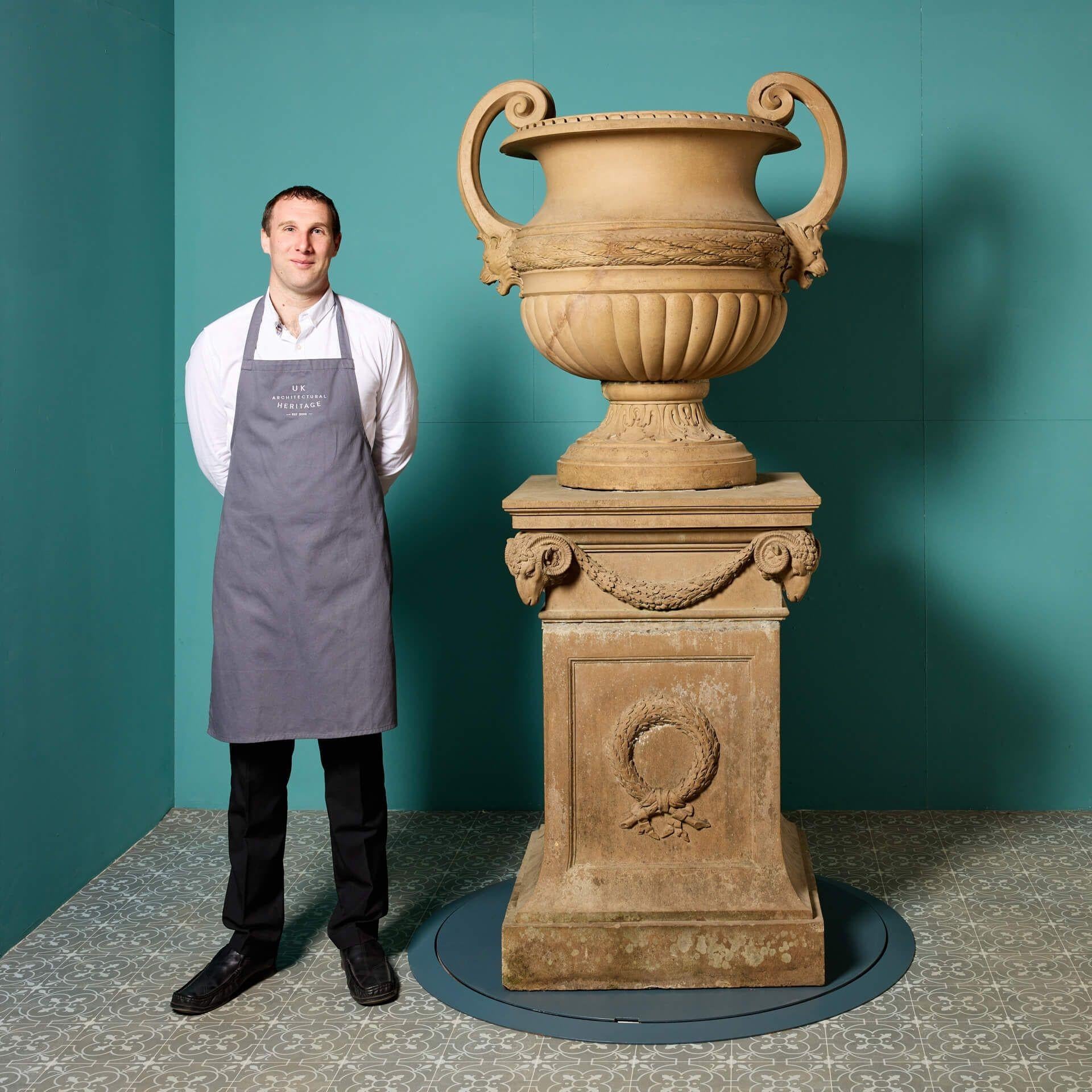 A monumental neoclassical style urn on a pedestal by Doulton & Co. This striking piece was from a private collection in Ireland. Crafted between 1877 and 1880, it has the Doulton mark stamped on the socle. It would certainly be a statement piece for