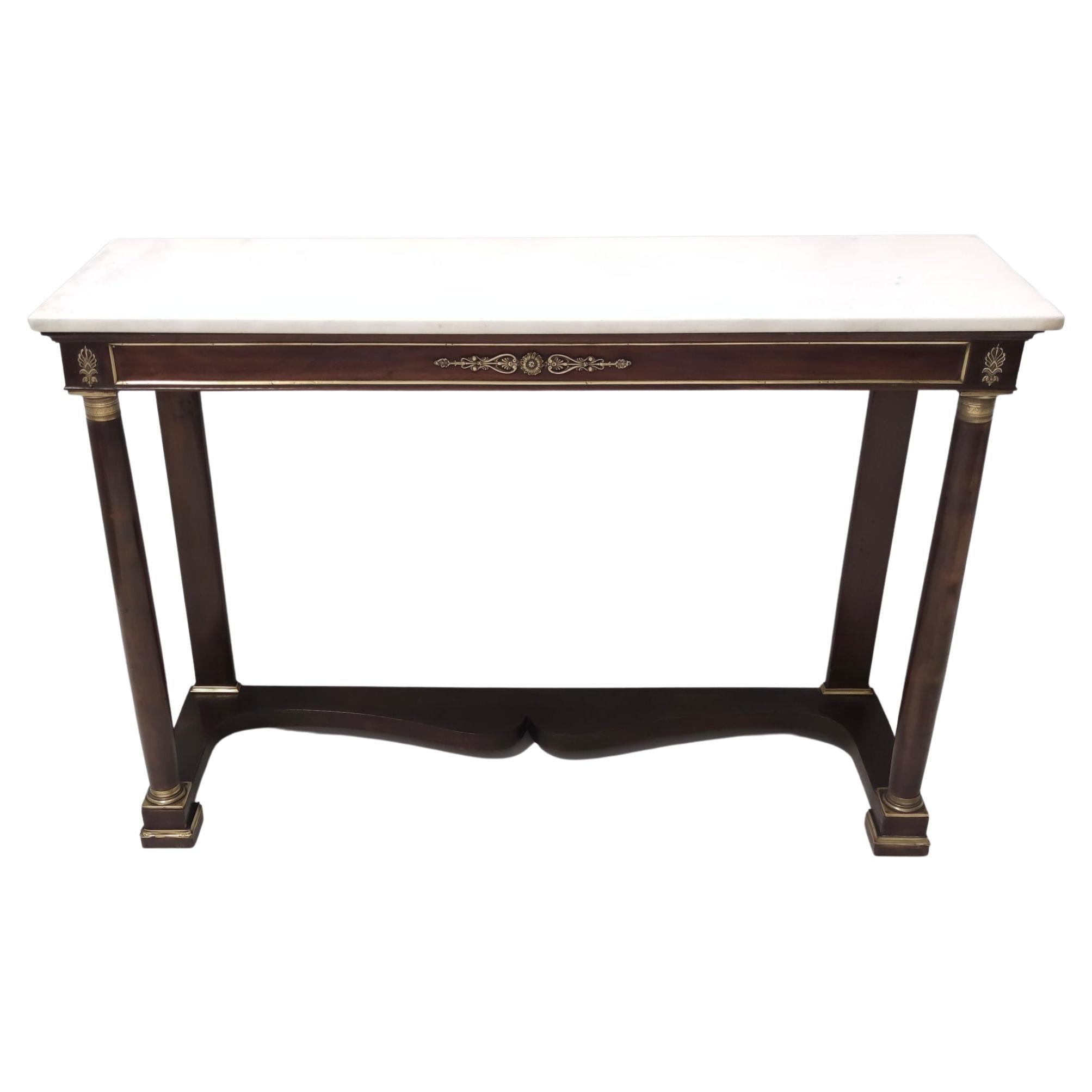 Made in Italy, 1940s. 
It features a walnut frame with a rectangular Carrara marble top and brass details. 
This console might show slight traces of use since it's vintage, but it can be considered as in excellent original condition and ready to