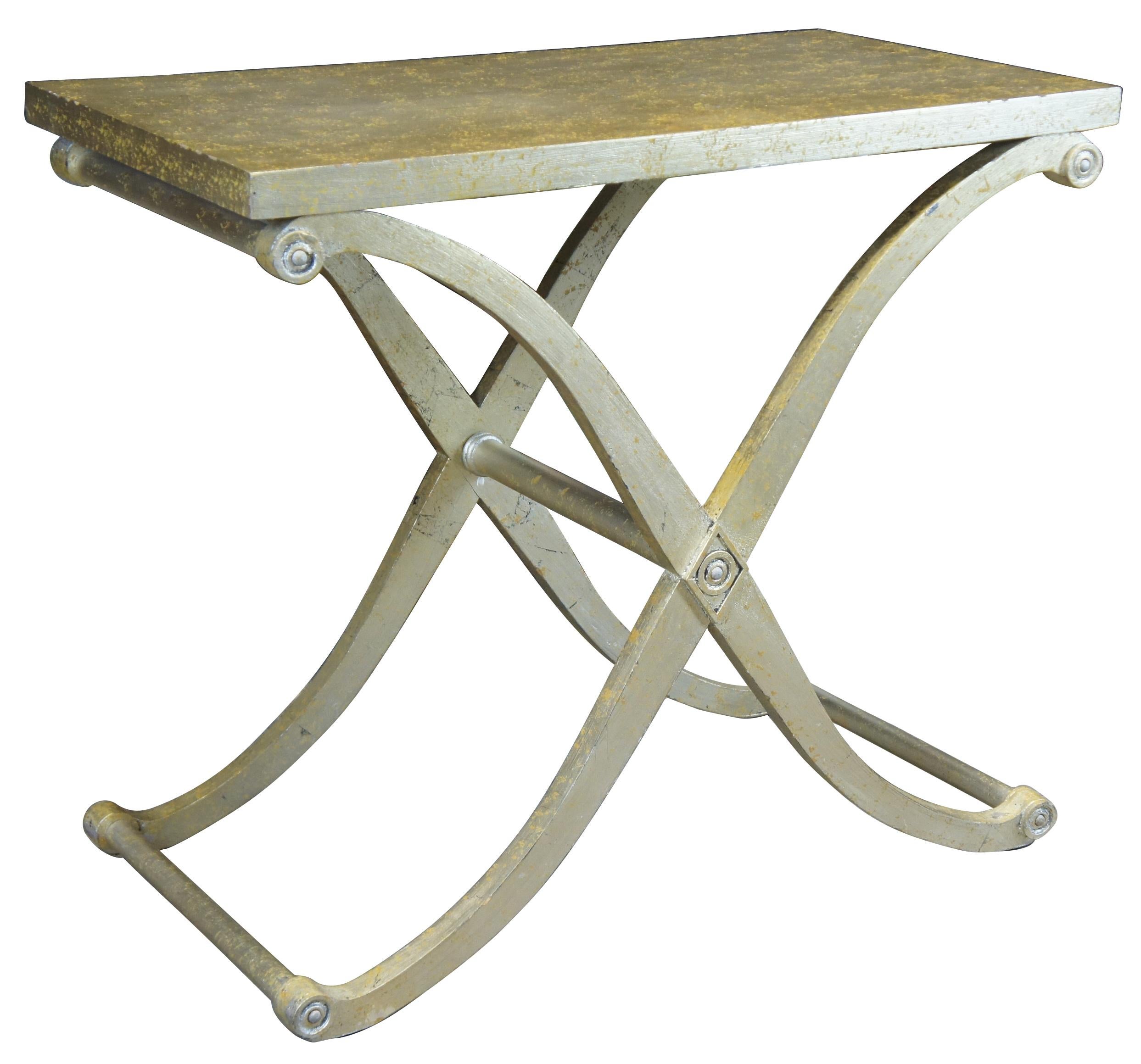 Neoclassical style console or entry table. Features an X shaped base in painted gold foil finish.
 