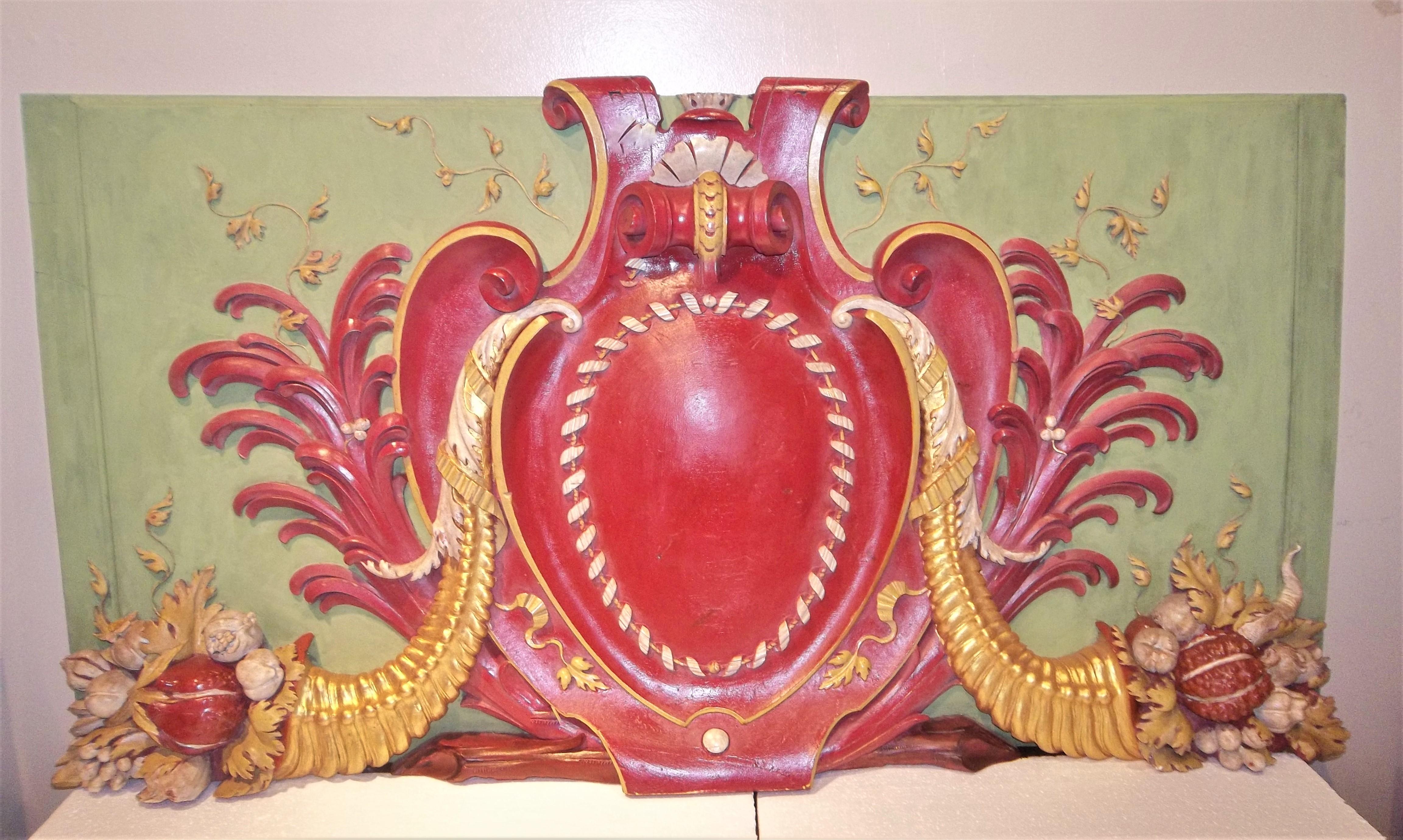 Paneling or boiseries overdoor (maybe a ballroom panel)with a cranberry red ground cartouche against overall French chalky lemon green panel. Central panel flanked by palm fronds and two gilt toned cornucopia with flowers , fruits and vegetables in