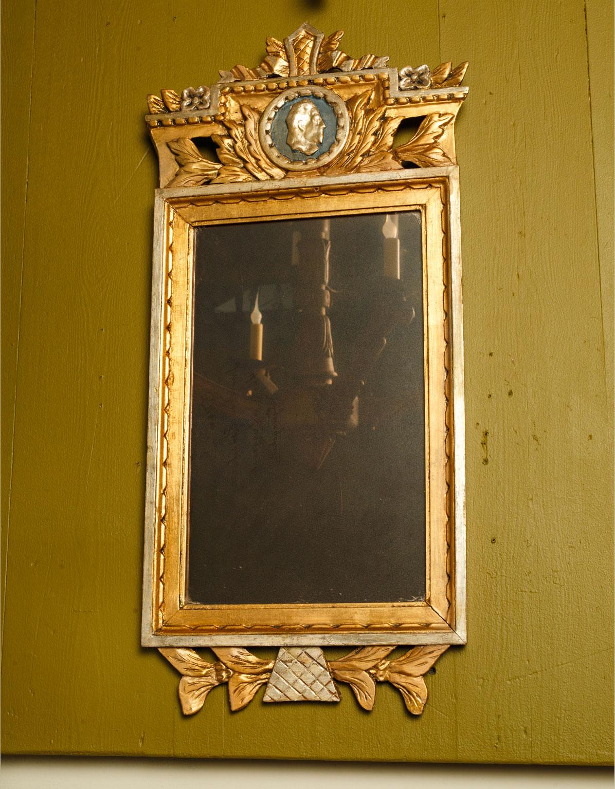 Neoclassical Swedish mirror in hand carved giltwood with hand-painted decoration. Signed on reverse, circa 1830-1850.