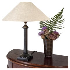 Neoclassical Table Lamp in patinated metal. 1940s.