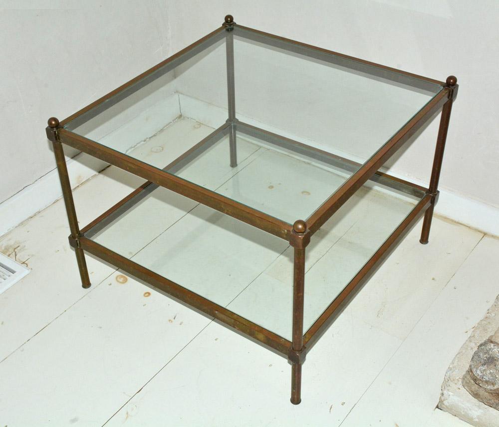 Maison Jansen style two-tier square brass contemporary coffee table has inset glass surfaces and is square. Original and beautifully aged brass patina but can be polished if a more sleek look is desired or suitable.