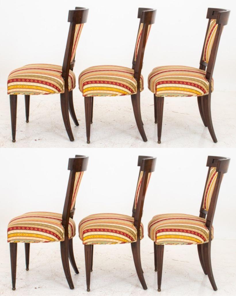 Group of six neoclassical style upholstered mahogany dining chairs raised on tapered legs.

Dealer: S138XX.