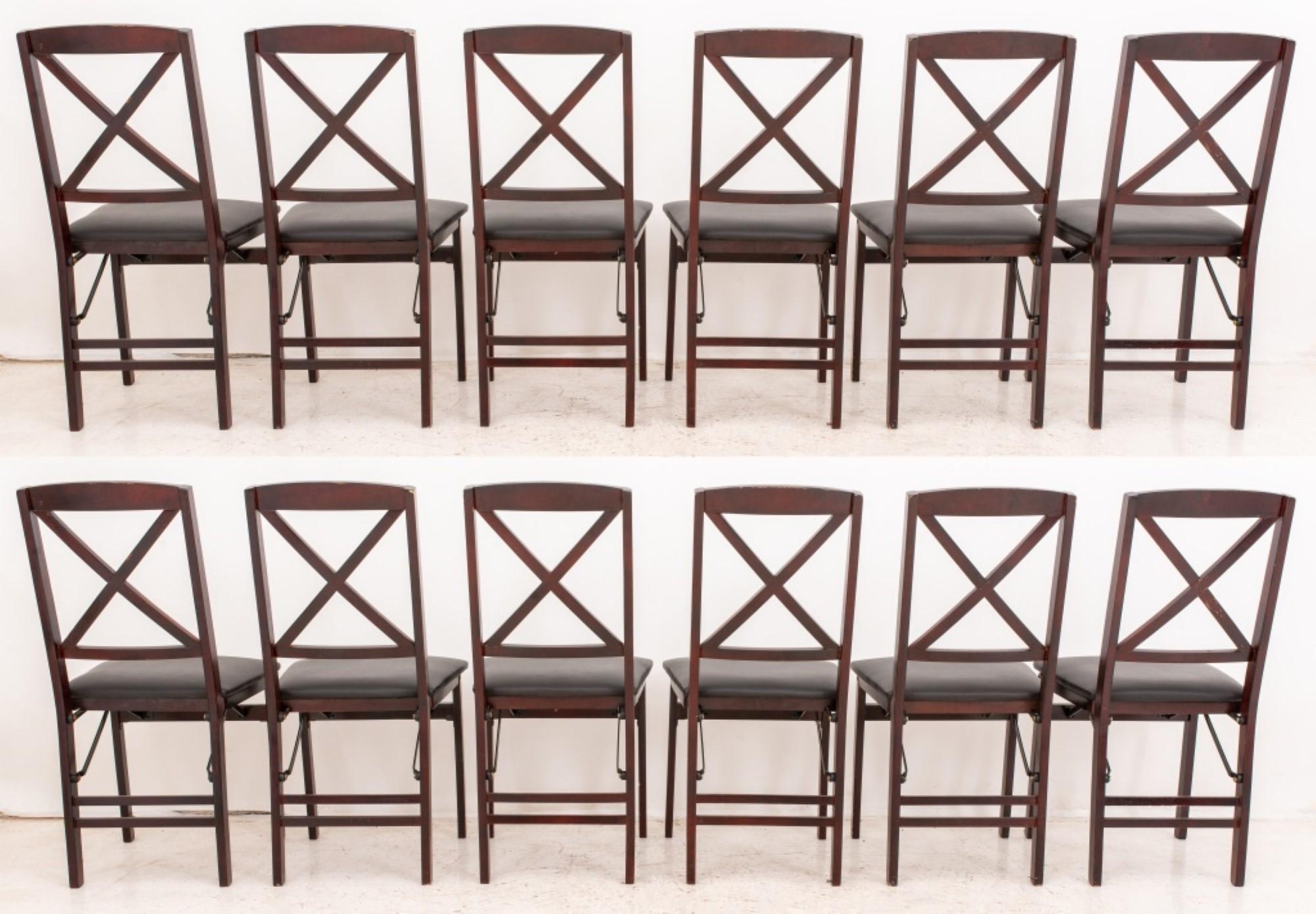The Neoclassical group of twelve mahogany folding chairs has the following dimensions:

Height: 35 inches
Width: 17 inches
Depth: 19 inches
Seat Height: 18 inches