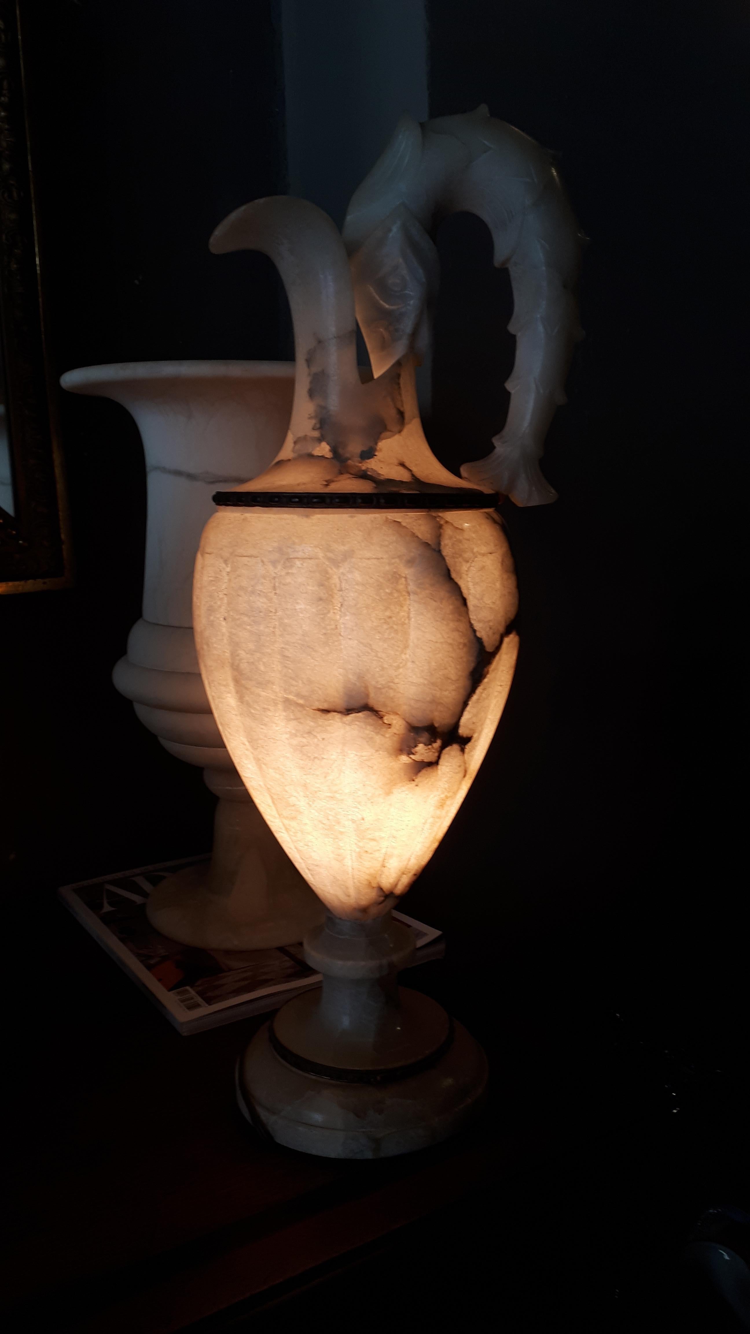 Urn Table Lamp with Jar design and carved Fish Handle and brass details. Spain, 1930s
Manufactured at the art deco period. It has an elegant neoclassical design. The carving fish as handle marks the difference in this piece.
This eye-catching