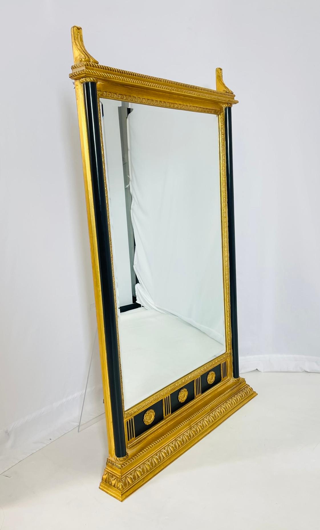 Elevate your space with this exquisite Neoclassical Wall Mirror by renowned designer Carol Canner for Carver's Guild. 
Designed and manufactured in the United States of America in the 1980s, this stunning piece features a signature design with