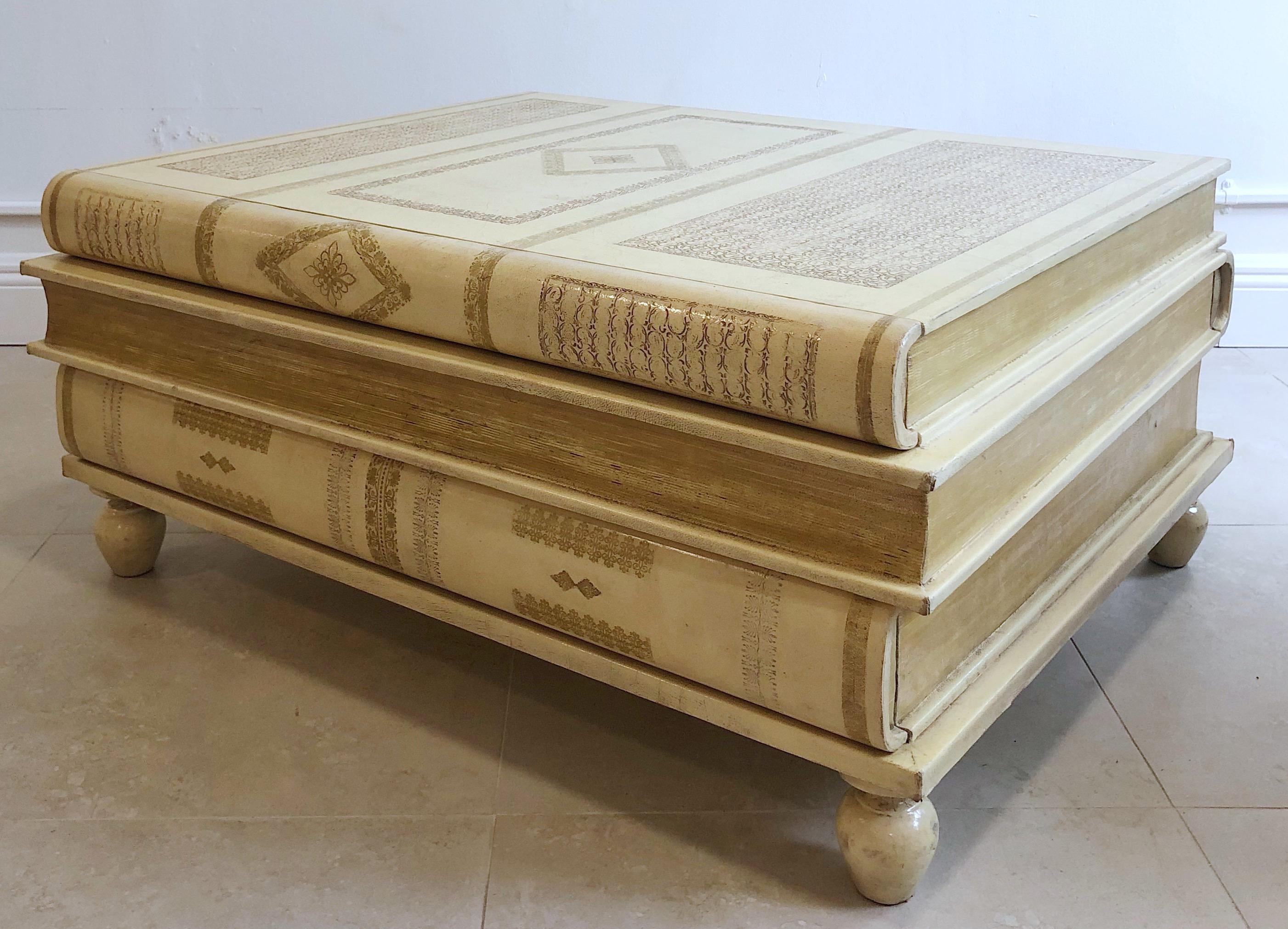 Neoclassical white- parchment leather book coffee table by Maitland-Smith, Three beautiful stacked warm white to parchment colored embossed leather tomes. Fitted with three long drawers, one 34.5