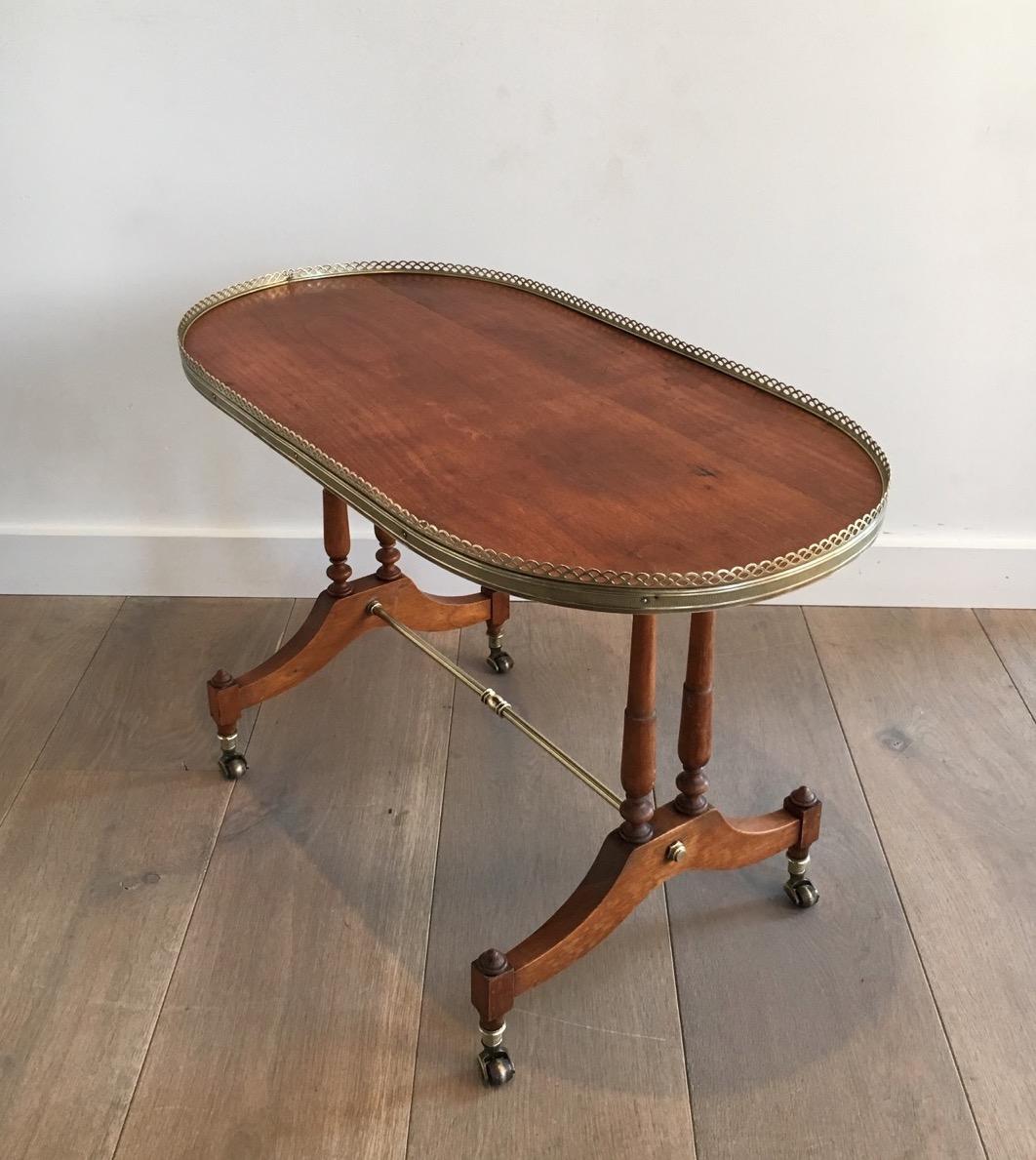Mid-Century Modern Neoclassical Wood and Brass Oval Coffee Table, circa 1940