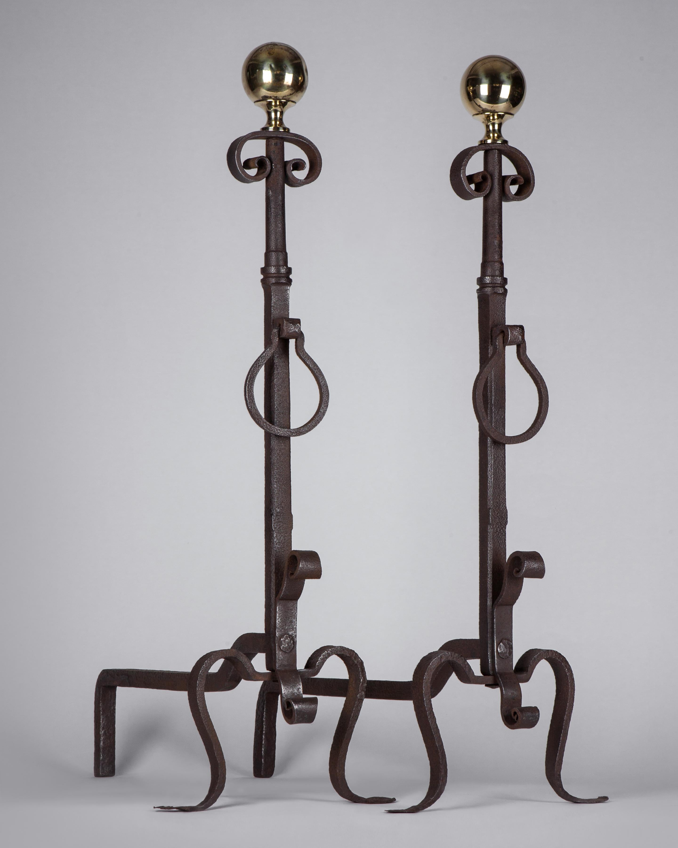 AFP0567

A pair of tall wrought iron andirons with drop-ring pendants, delicate penny feet, and large polished brass ball finials, circa 1900.

Dimensions:
Overall: 34