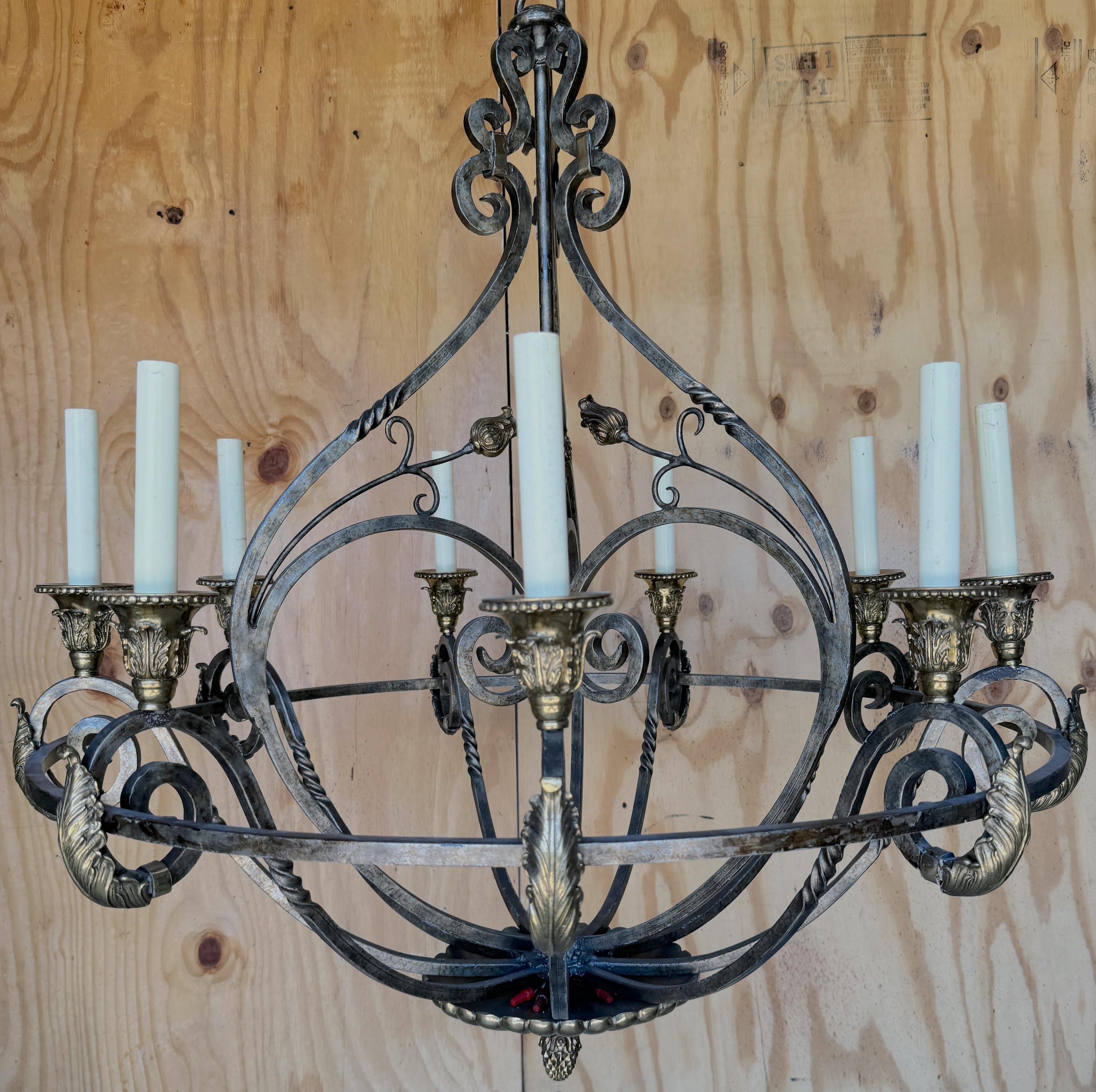 Neoclassical Wrought Iron & Brass 8-Light Chandelier, by Maitland Smith
An exquisite Neoclassical Wrought Iron & Brass 8-Light Chandelier, made by Maitland Smith. The chandelier  has a tailored circular design, measuring 42 inches in diameter and