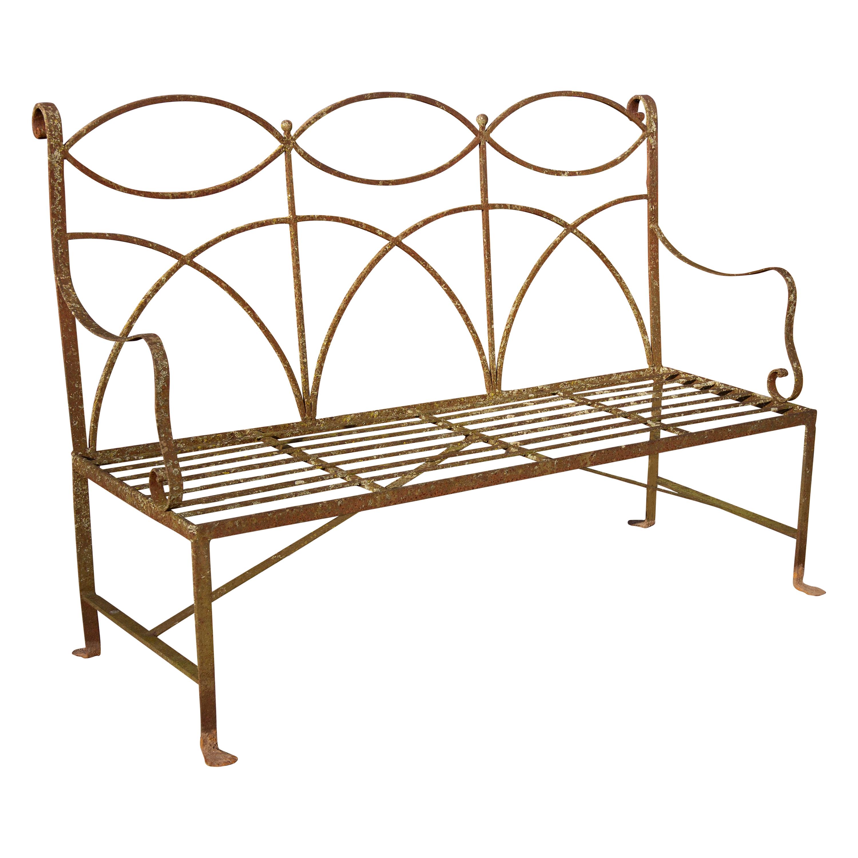 Wrought iron neoclassical garden bench. Simple elegant lines. Wonderful weathered surface. Handmade, circa 1900s-1920s. Seats four. Structurally sound.