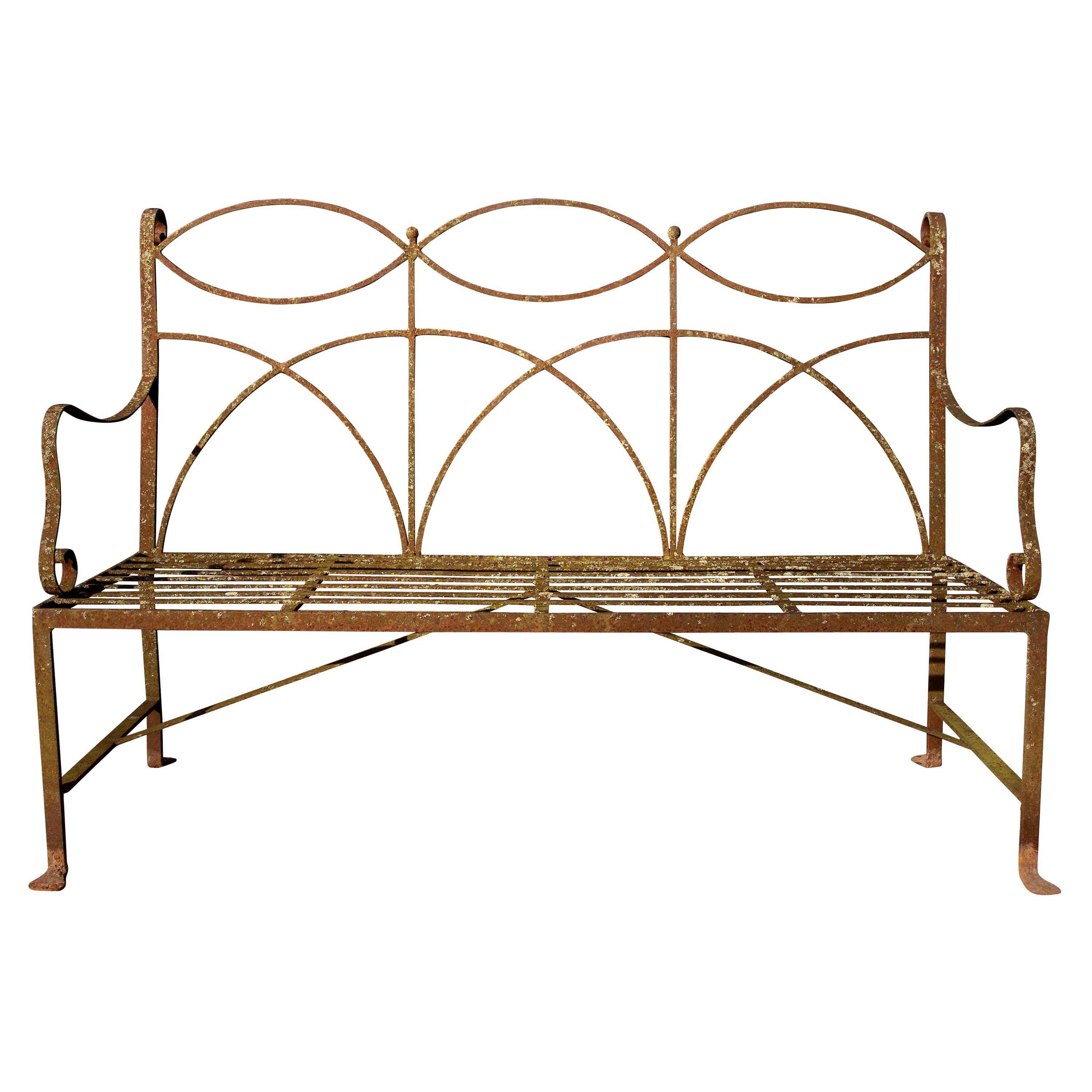 Wrought iron neoclassical garden bench. Simple elegant lines. Wonderful weathered surface. Handmade, circa 1900s-1920s. Seats four. Structurally solid.