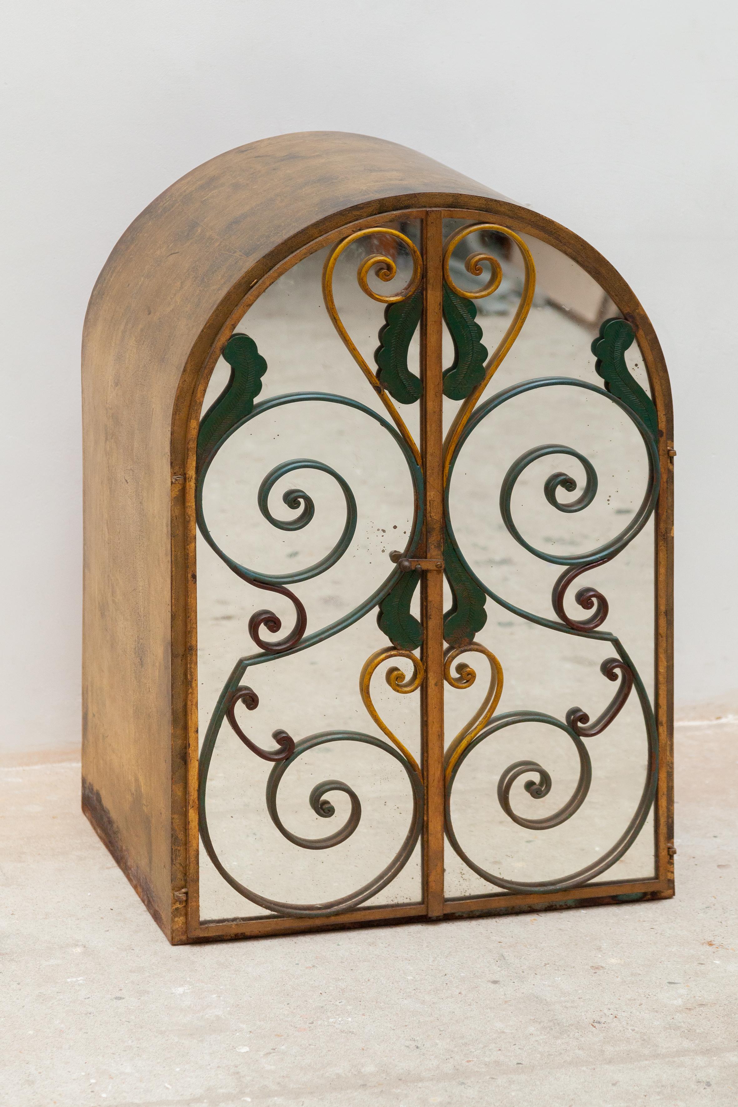 Wrought iron bar wine cabinet is made from hand-forged wrought iron, and features intricate leaf designs as well as beautiful scrollwork made in France 1940s.
 