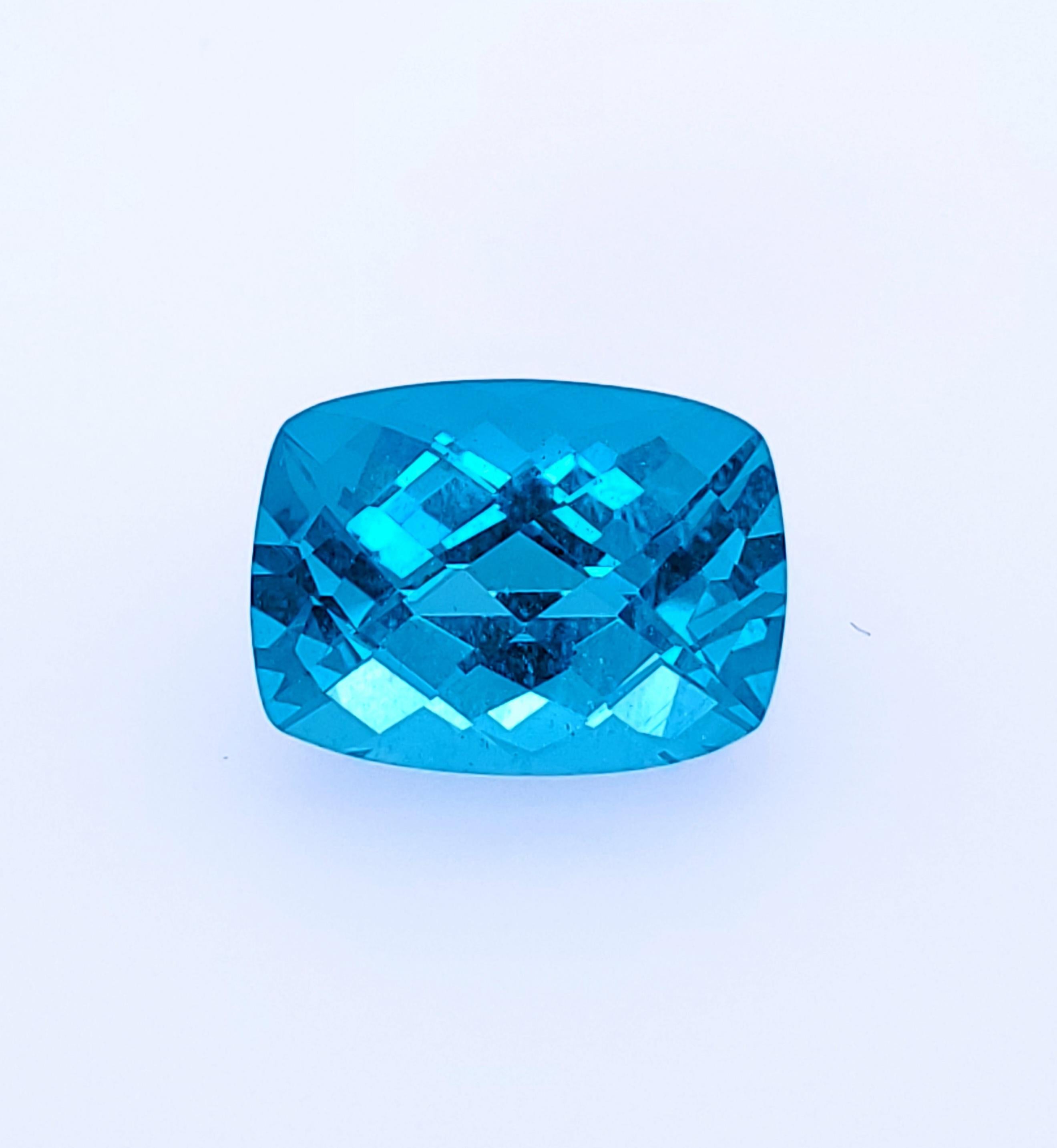 Very Large 10.72ct Cushion Cut Neon Paraiba Blue Apatite. It truly has that Paraiba Blue color, and can be seen from 30 feet away with no problem! An incredible piece and the body color  - Think of a bright neon Caribbean Ocean if you are unfamiliar
