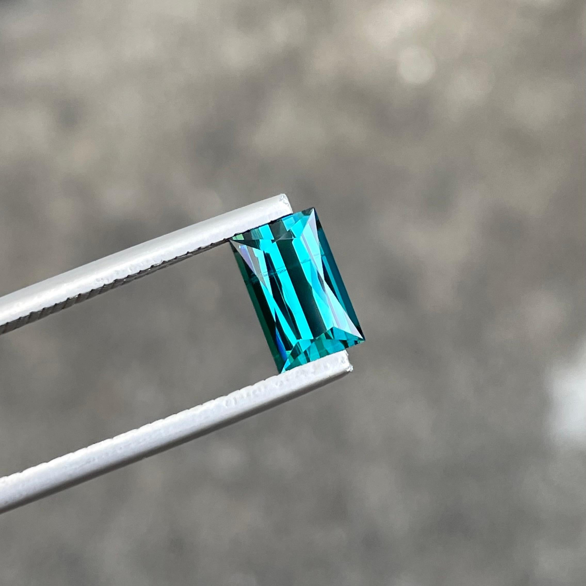 Gemstone Type	Tourmaline Gemstone
Weight	1.65 carats
Dimensions	8.3 x 5.3 x 4.1 mm
Clarity	SI (Slightly Included)
Shape	Rectangular
Cut	Scissors
Origin	Afghanistan
Treatment	None



The Neon Blue Tourmaline is a true marvel of nature, boasting a