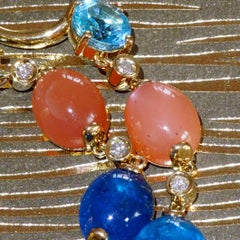Neon blue paraibacolored Apatite Topaz and Moonstone Earrings 18 kt Strong Color