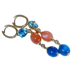 Neon blue paraibacolored Apatite Topaz and Moonstone Earrings 18 kt Strong Color