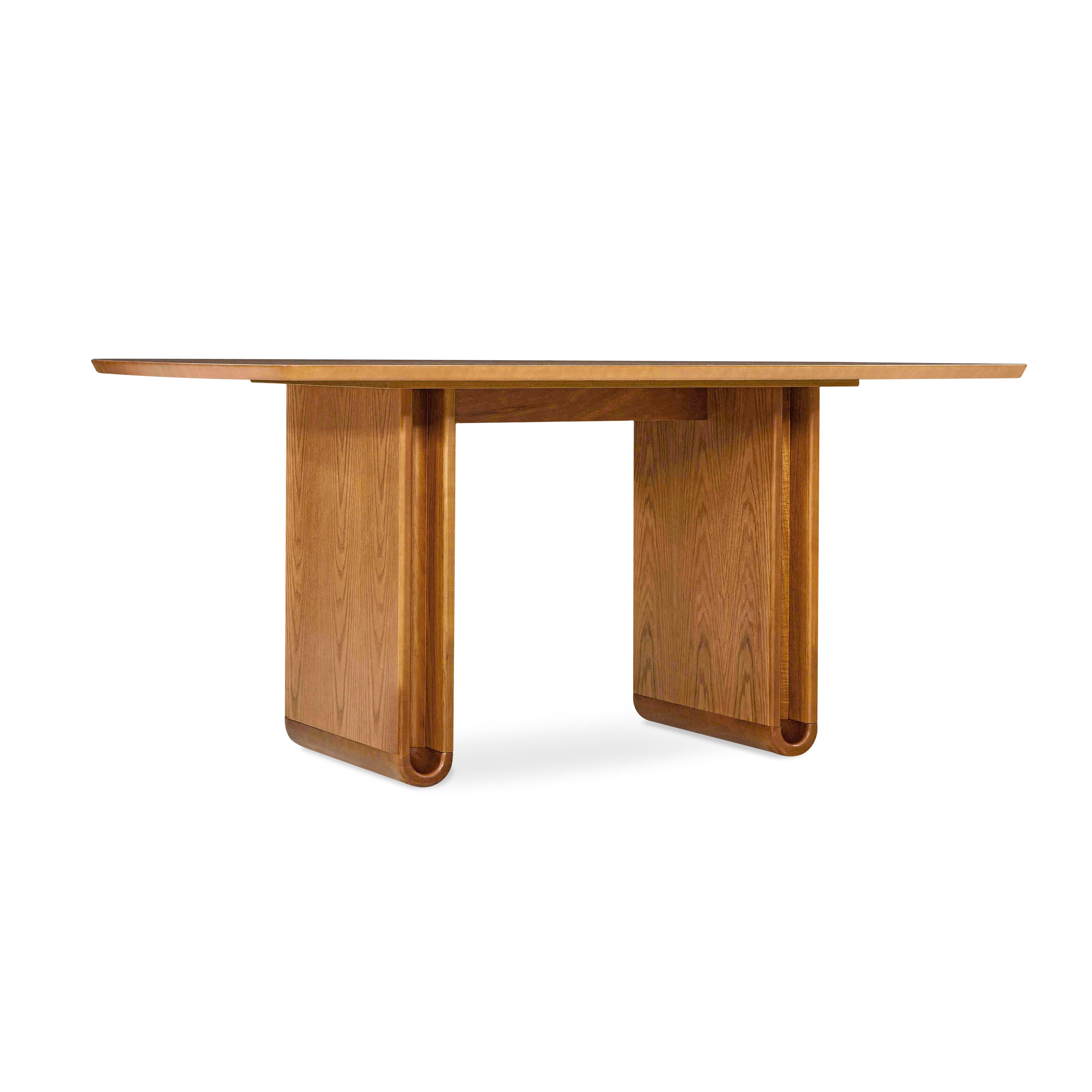 The refined shapes of the Neon dining table in oak make it a uniquely shaped addition to your dining room. It is a sophisticated table for a modern contemporary or minimalist decor with symmetrical proportions along with the curved detail of the